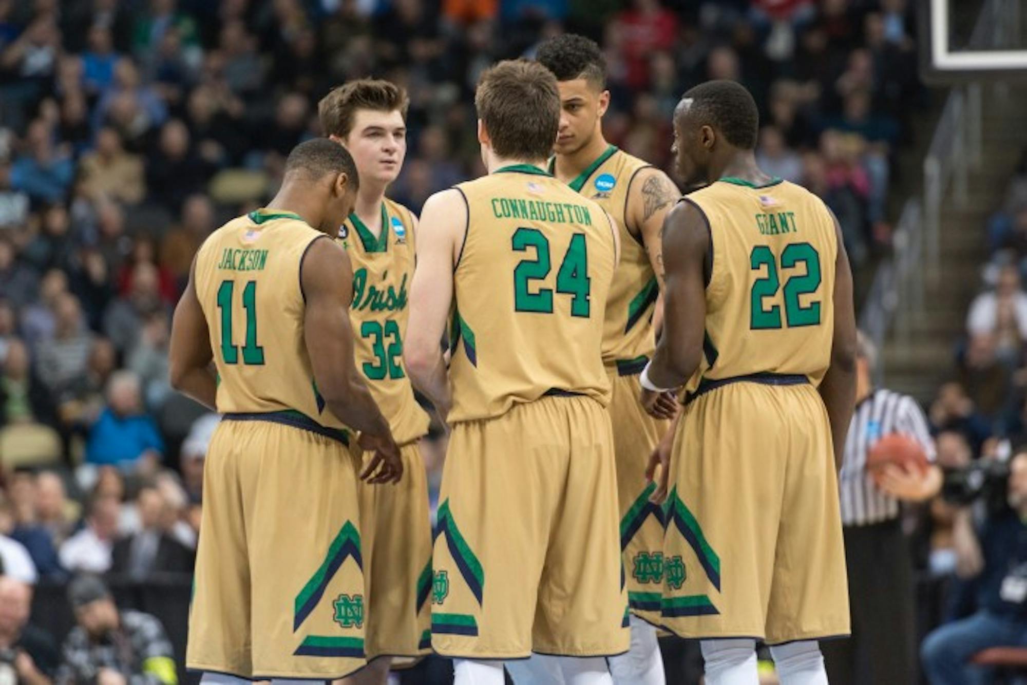 The Irish starters — from left , sophomores Demetrius Jackson and Steve Vasturia, senior Pat Connaughton, junior Zach Auguste and senior Jerian Grant — huddle March 19 during a 69-65 win over Northeastern.