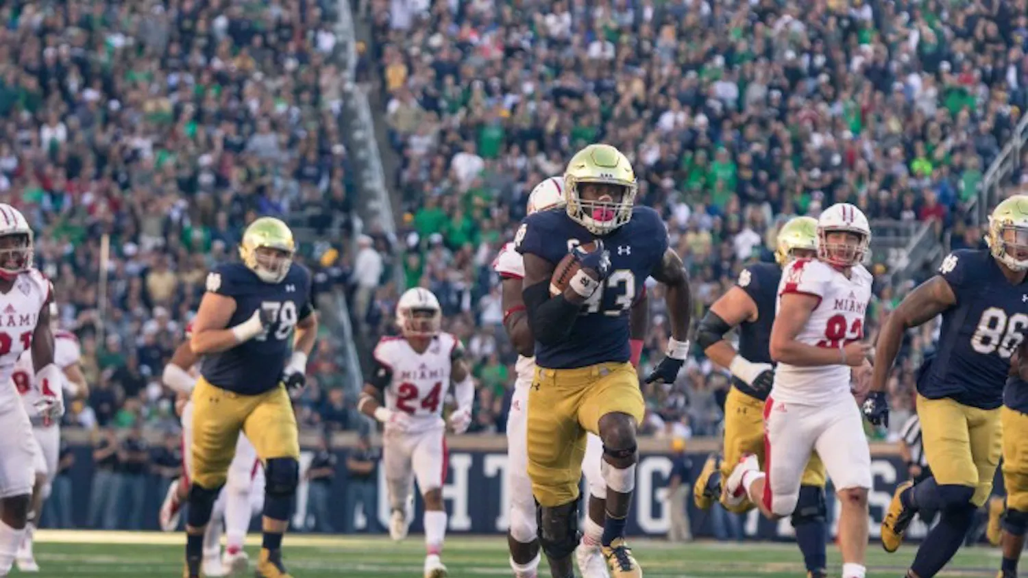 Irish junior running back Josh Adams breaks away from the back for a touchdown run during Notre Dame’s 52-17 win over Miami (OH) on Saturday at Notre Dame Stadium.
