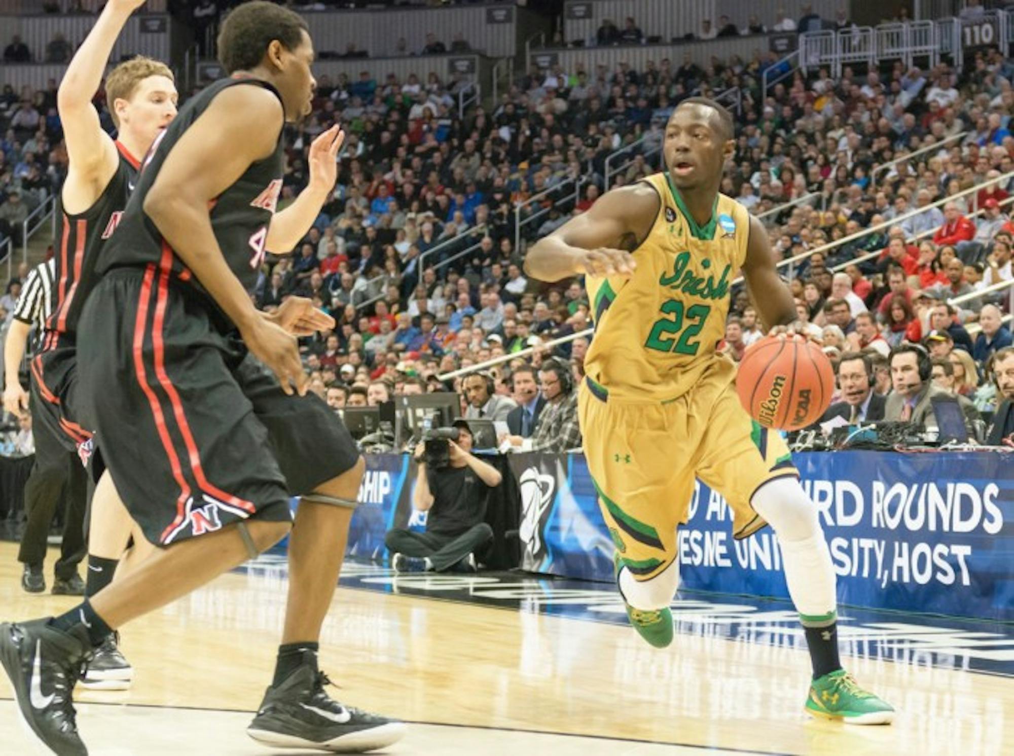 Irish senior guard Jerian Grant drives around a Northeastern defender during Notre Dame's 69-65 win to advance to the third round of the NCAA Tournament on March 19.