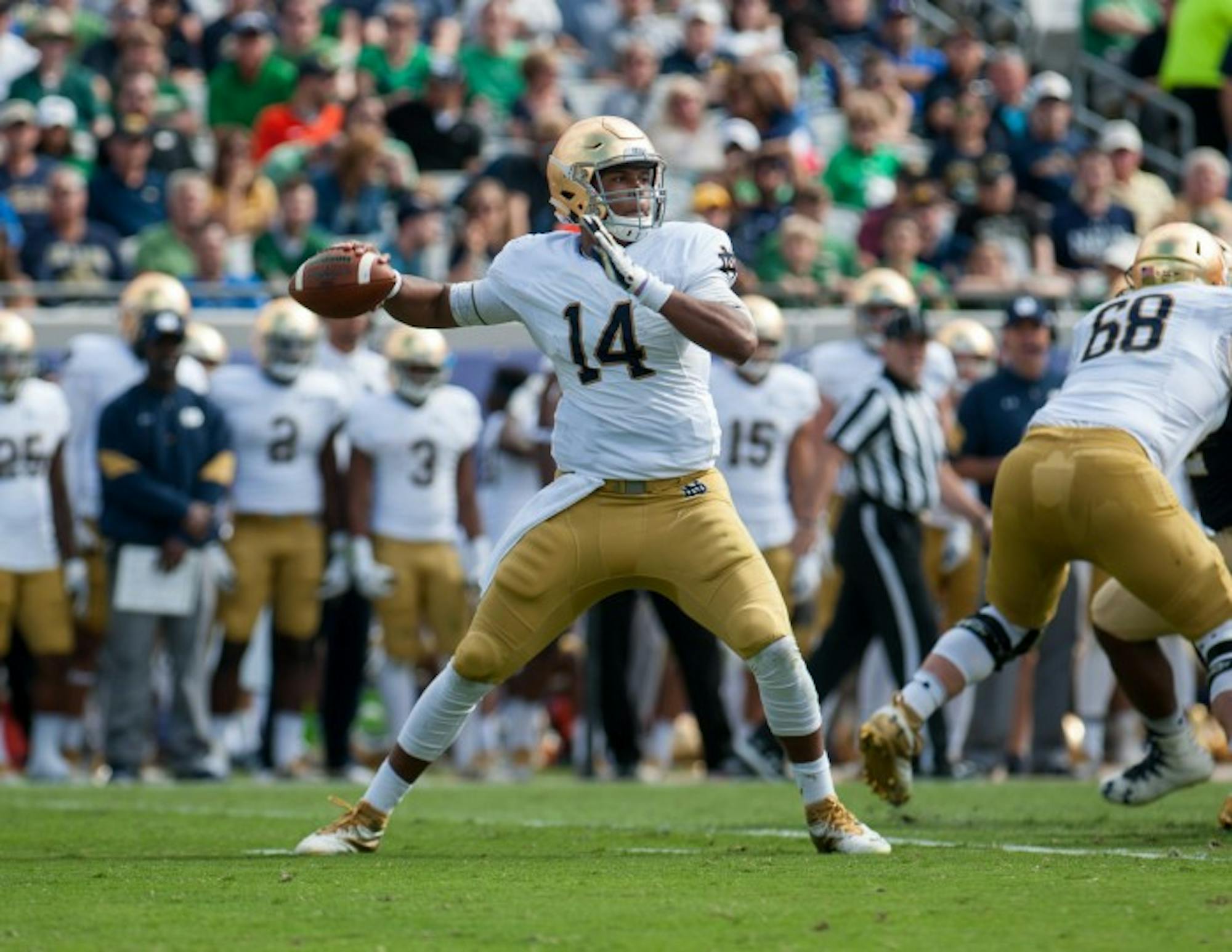 Junior quarterback DeShone Kizer drops back to pass during Notre Dame's 28-27 loss to Navy. Kizer threw for 223 yards and three touchdowns on the game.