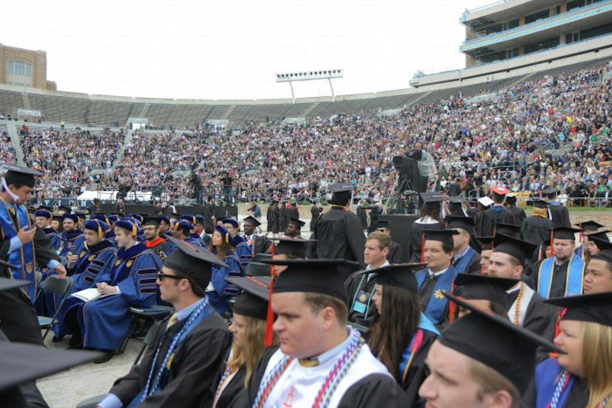 Students participate in a walk out during Vice President Mike Pence's speech at Commencement. Approximately 150 students, friends and family members participated in the walkout.