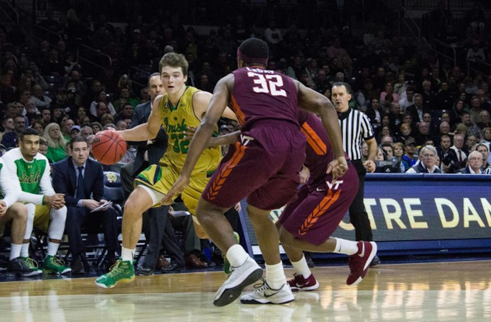 Irish junior guard Steve Vasturia looks to maneuver around two Virginia Tech defenders during Notre Dame’s 83-81 victory on Wednesday at Purcell Pavilion. Vasturia filled in at point guard and scored 16 points Saturday after junior guard Demetrius Jackson left with an injury.