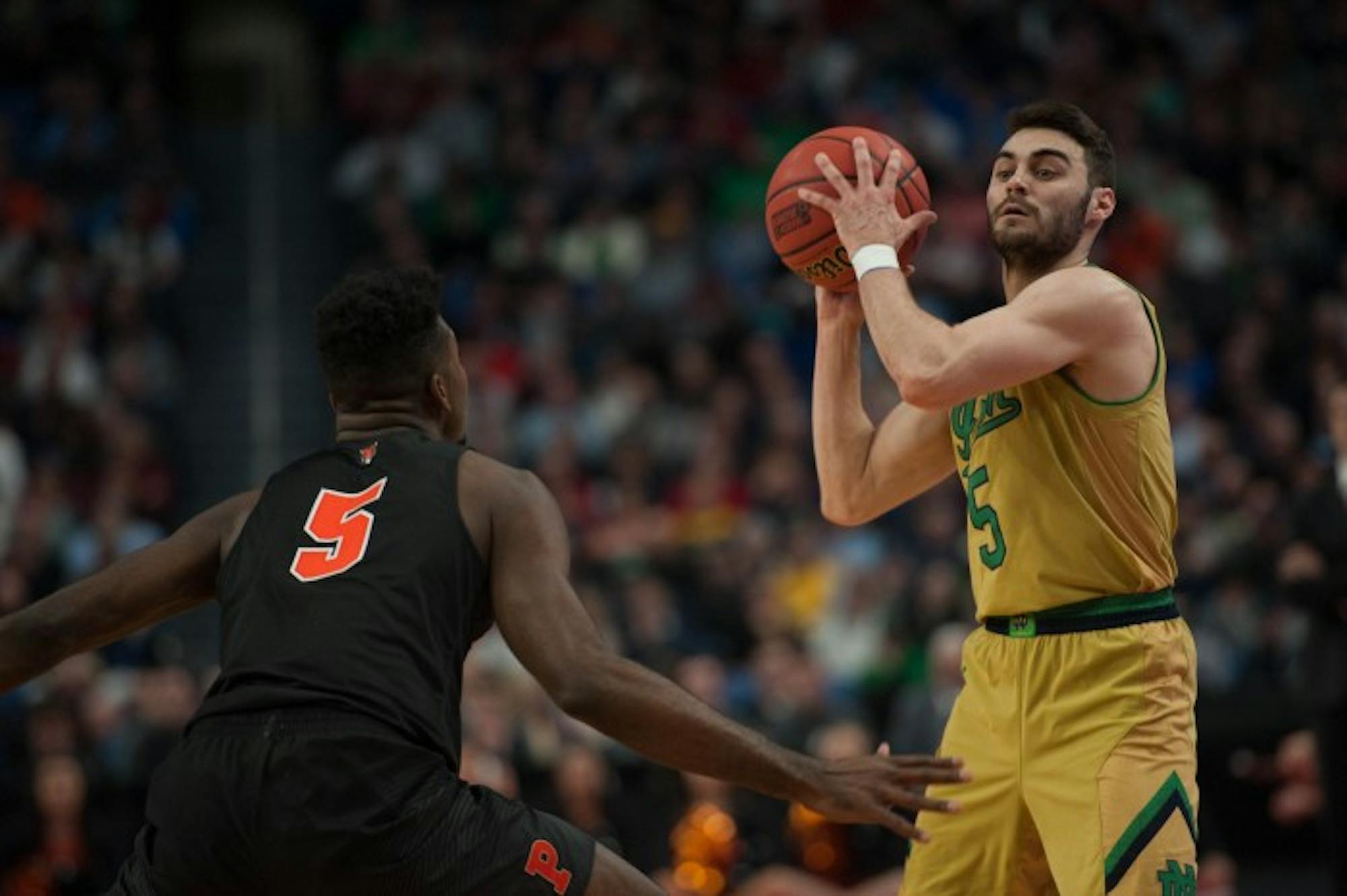 Irish junior guard Matt Farrell looks to pass during Notre Dame’s 60-58 win over Princeton on Thursday at Buffalo, New York’s KeyBank Center.