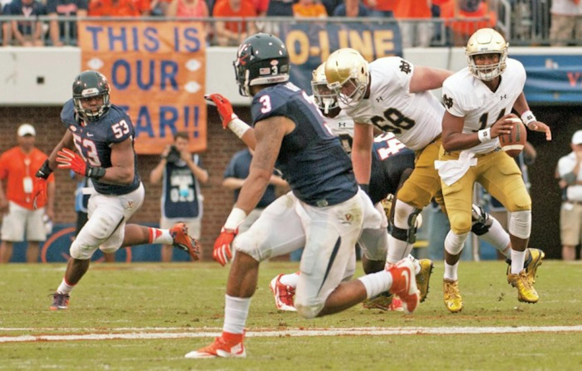 Irish junior quarterback DeShone Kizer scrambles during Notre Dame’s 34-27 win at Virginia on Sept. 12. After entering for the injured Malik Zaire, Kizer beat Virginia, then went 8-3 as a starter the rest of the way.