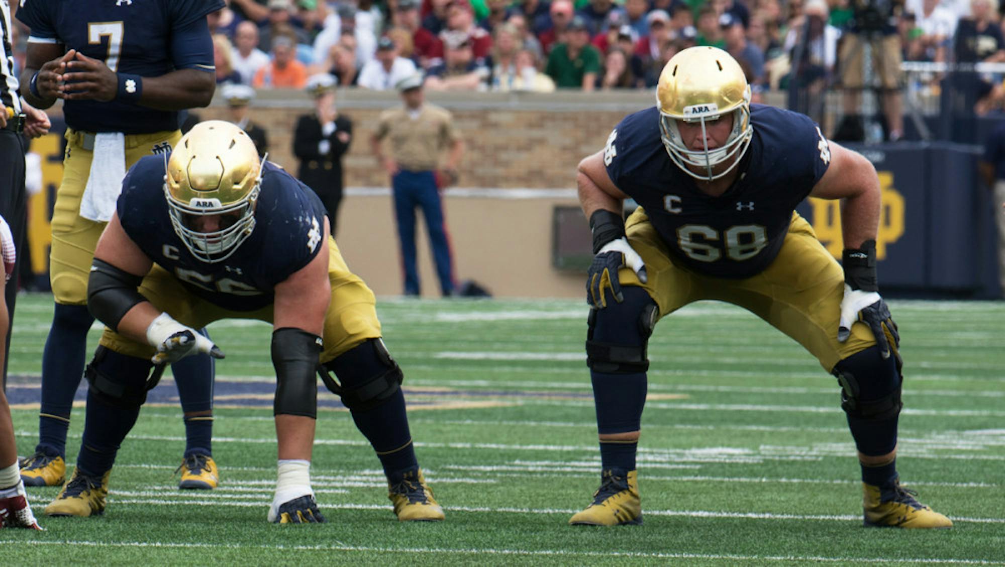 Irish offensive linemen senior Quenton Nelson, left, and graduate student Mike McGlinchey wait for the snap during Notre Dame’s 49-16 win over Temple on Saturday at Notre Dame Stadium.