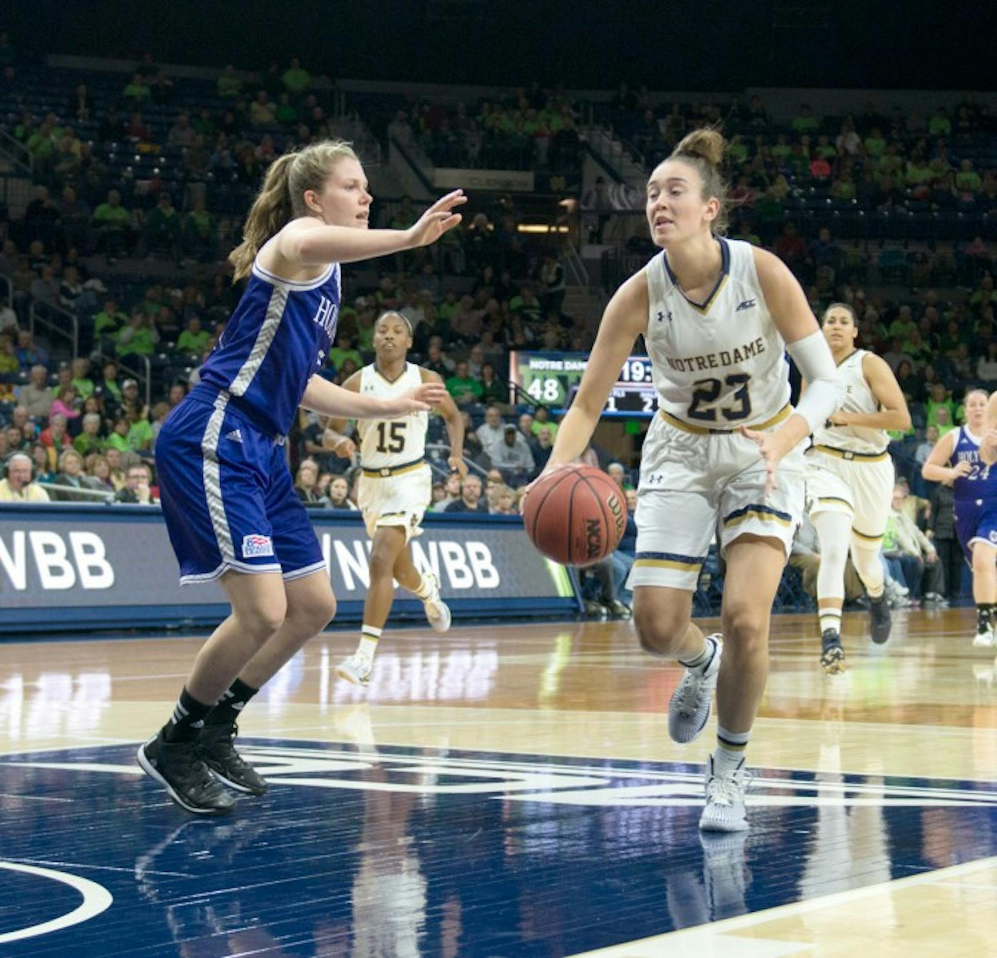Irish junior guard Michaela Mabrey drives to the basket during Notre Dame’s 104-29 victory over Holy Cross on Nov. 23 at Purcell Pavilion. Mabrey scored 17 points in Notre Dame’s win over Kansas on Sunday.