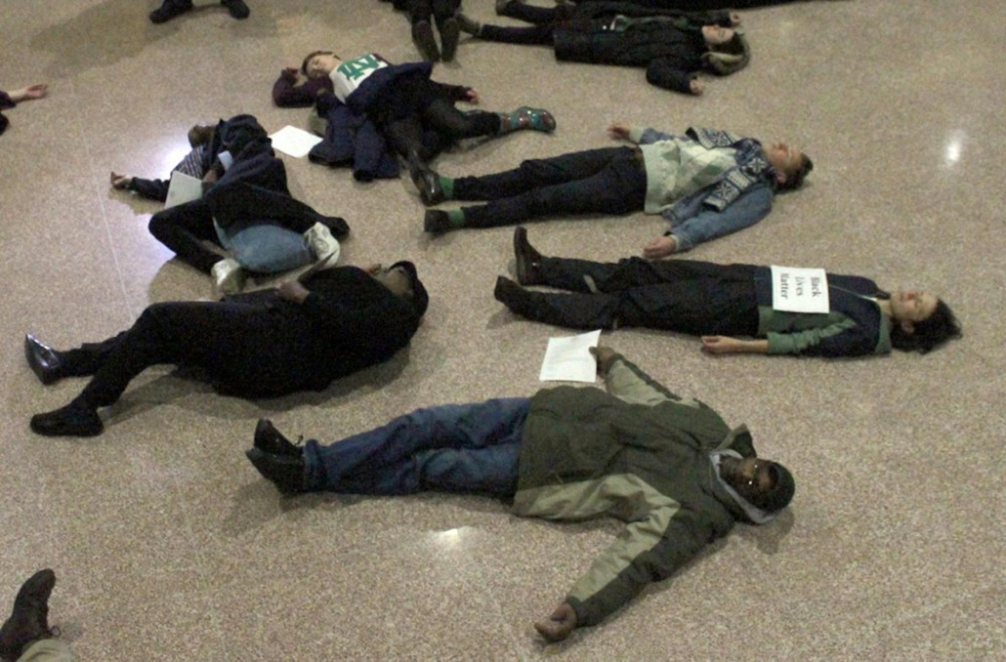 Notre Dame students and South Bend community members “die in” at the South Bend city council building on Monday to protest racism.