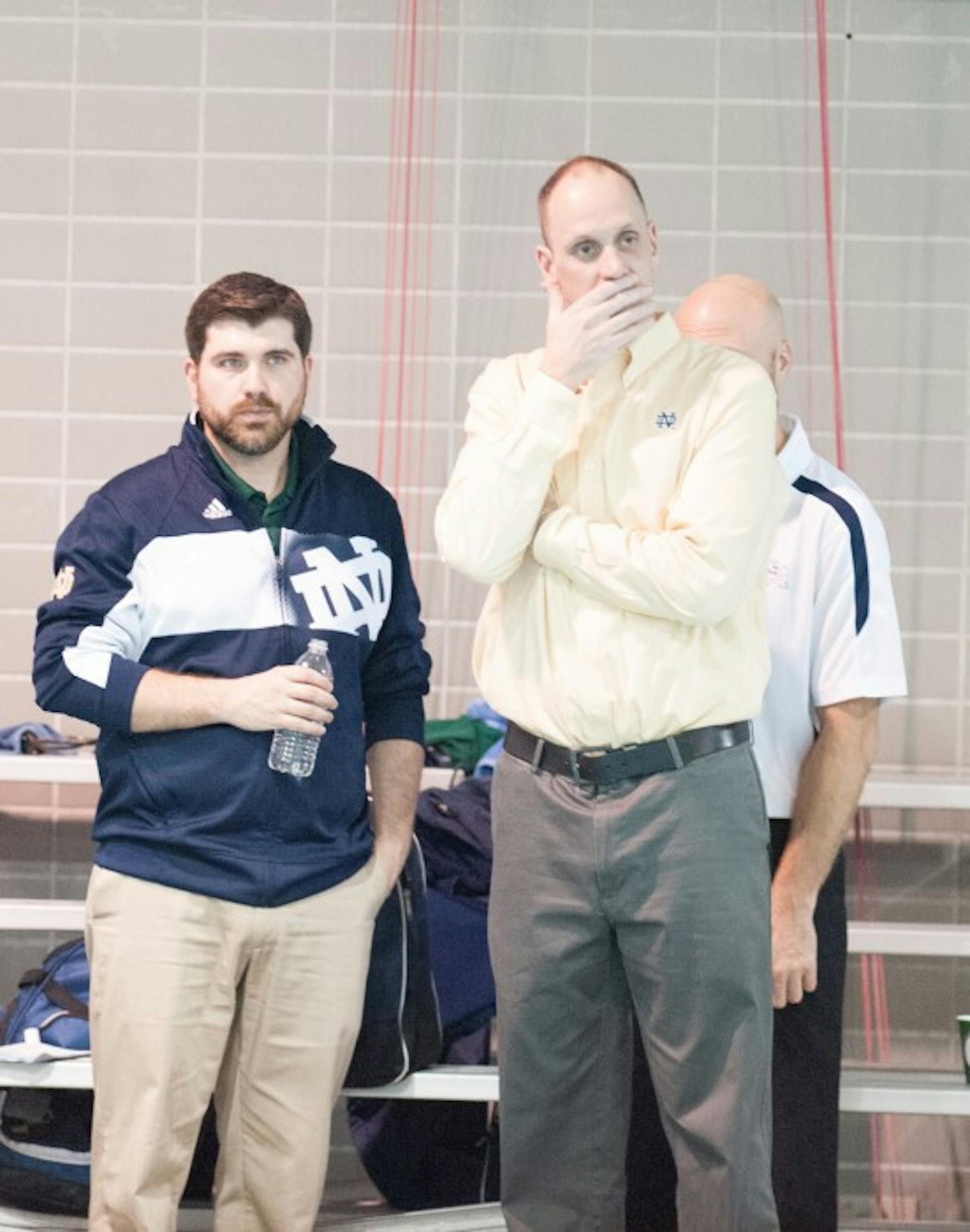 Former Irish coach Brian Barnes, right, watches his team compete against Iowa at the Shamrock Invitational on Jan. 31.
