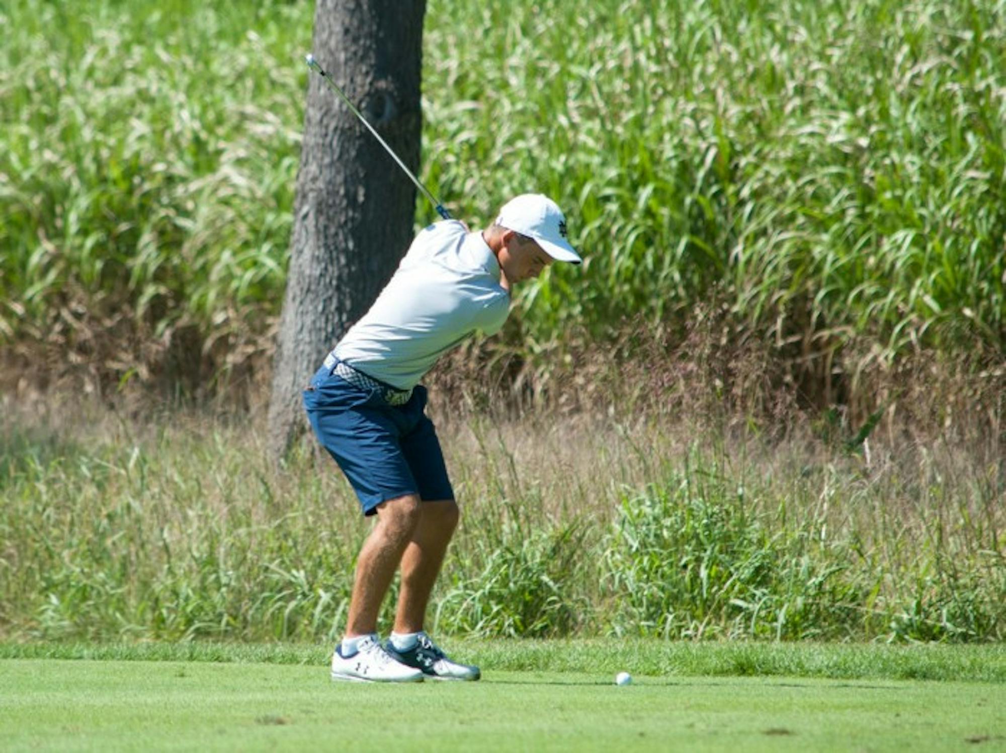 Irish freshman John Felitto hits an iron from the fairway during the Notre Dame Kickoff Challenge on Sep. 3 at Warren Golf Course.