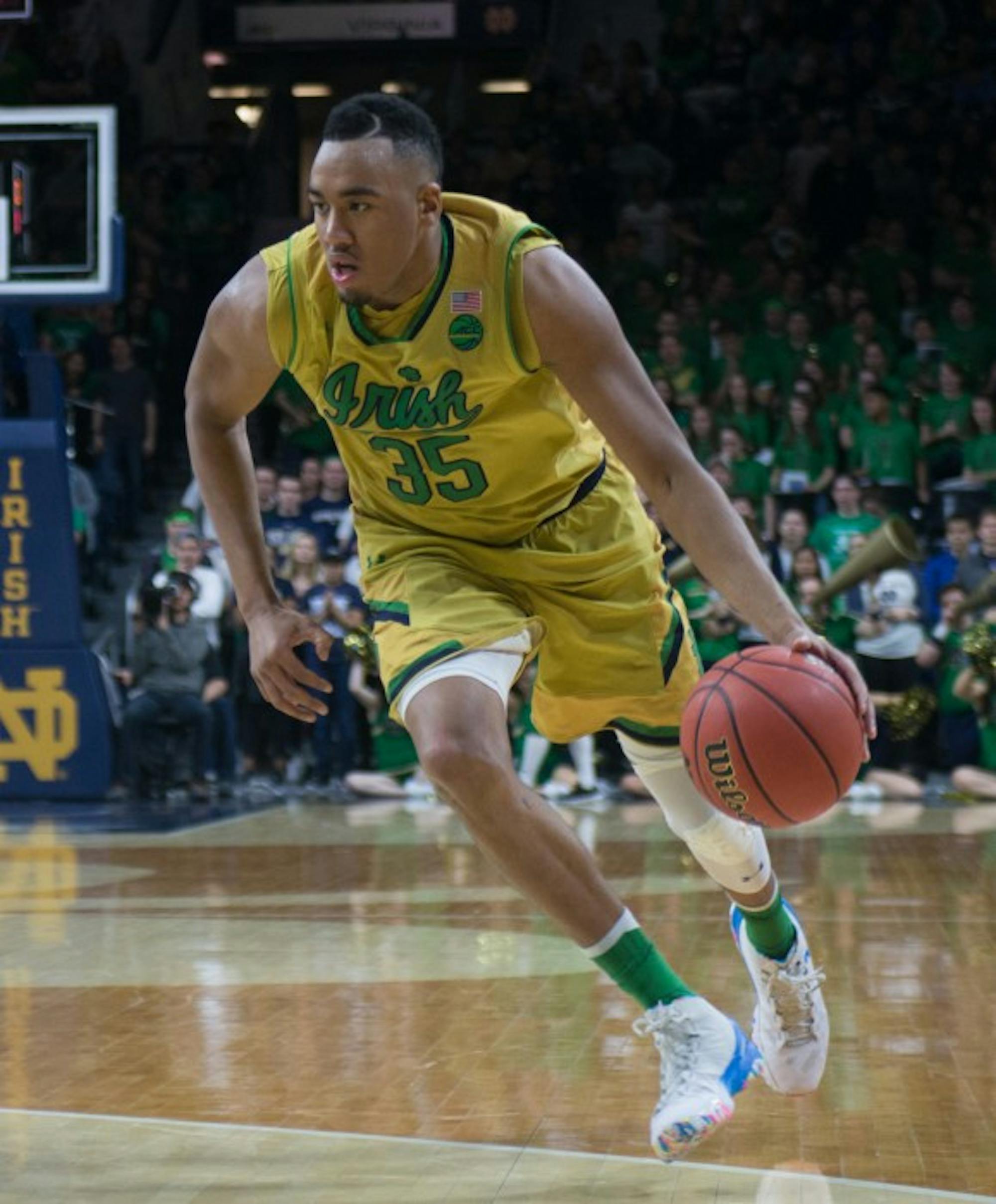 Irish junior forward Bonzie Colson dribbles into the Georgia Tech defense during Notre Dame's 64-60 victory over the Yellow Jackets on Sunday night. Colson picked up 20 points and 11 rebounds in his 17th double-double of the season.