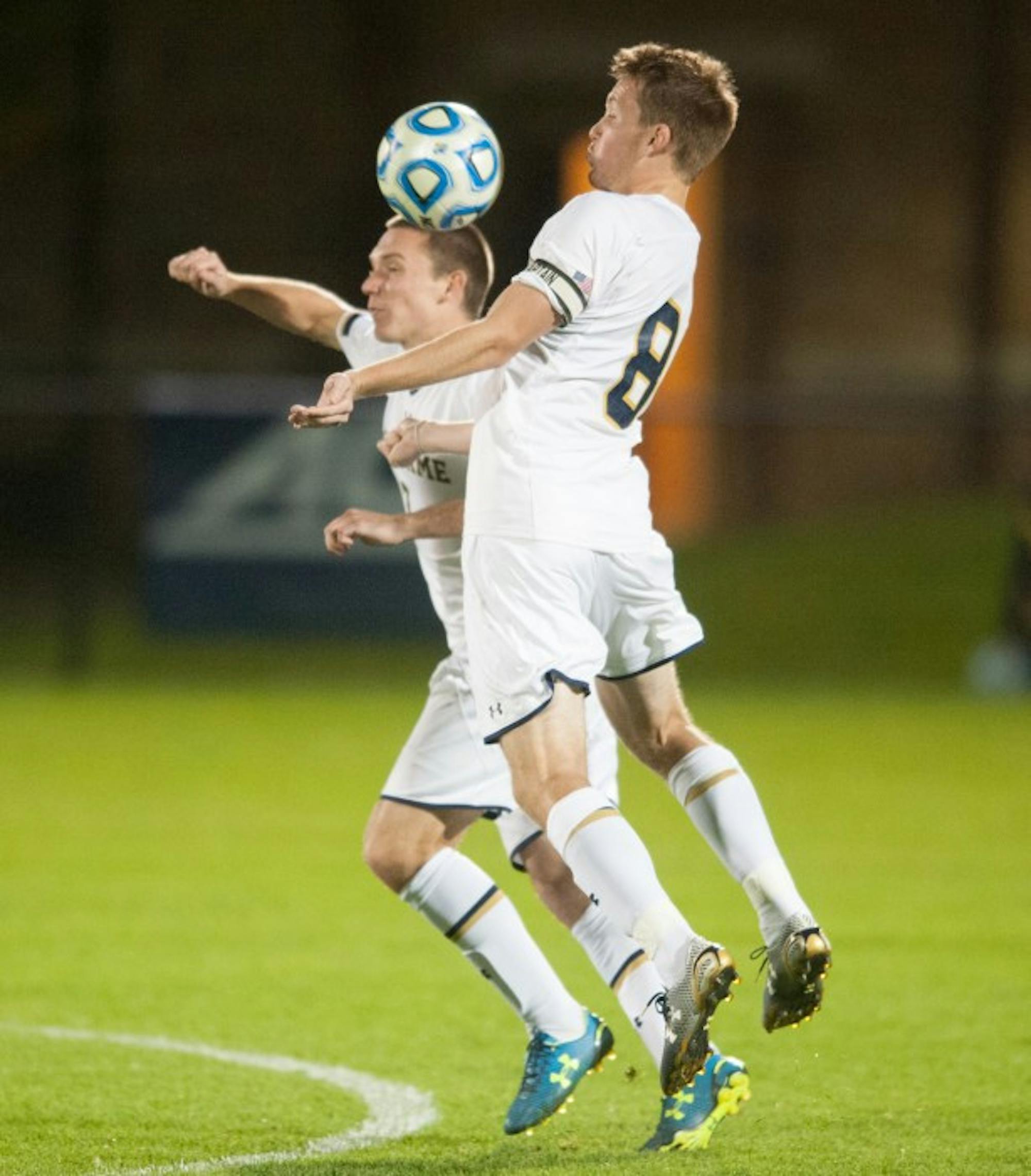 Irish senior midfielder and captain Nick Besler, right, goes up for a ball in the air during Notre Dame’s 1-0 win over VCU on Tuesday.