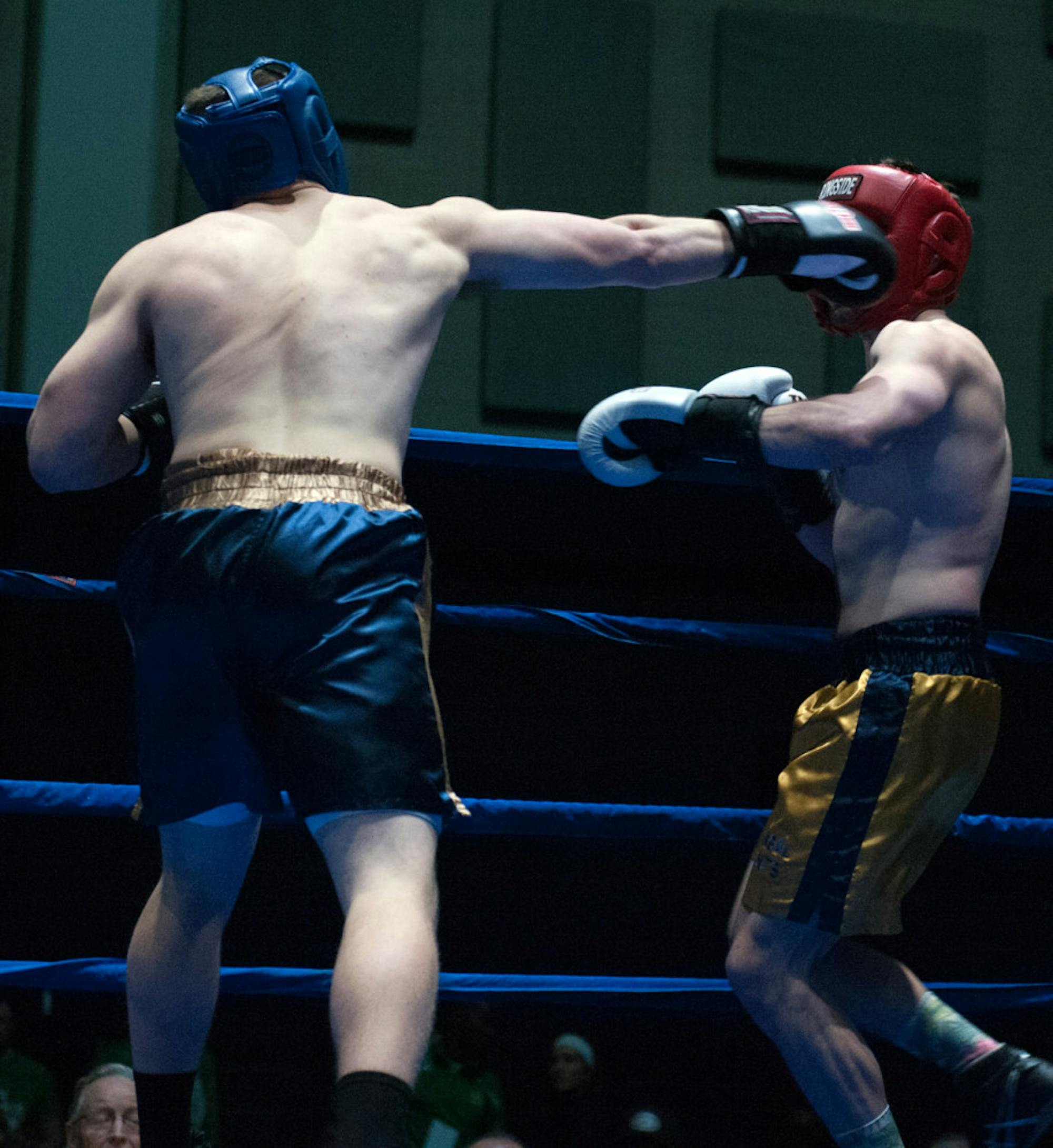 Senior Bengal Bouts captain Bryan Cooley, left, throws a jab during his semifinal victory over graduate student C.J. Pruner on Tuesday at Joyce Fieldhouse. Cooley fights for the 184-pound title tonight.