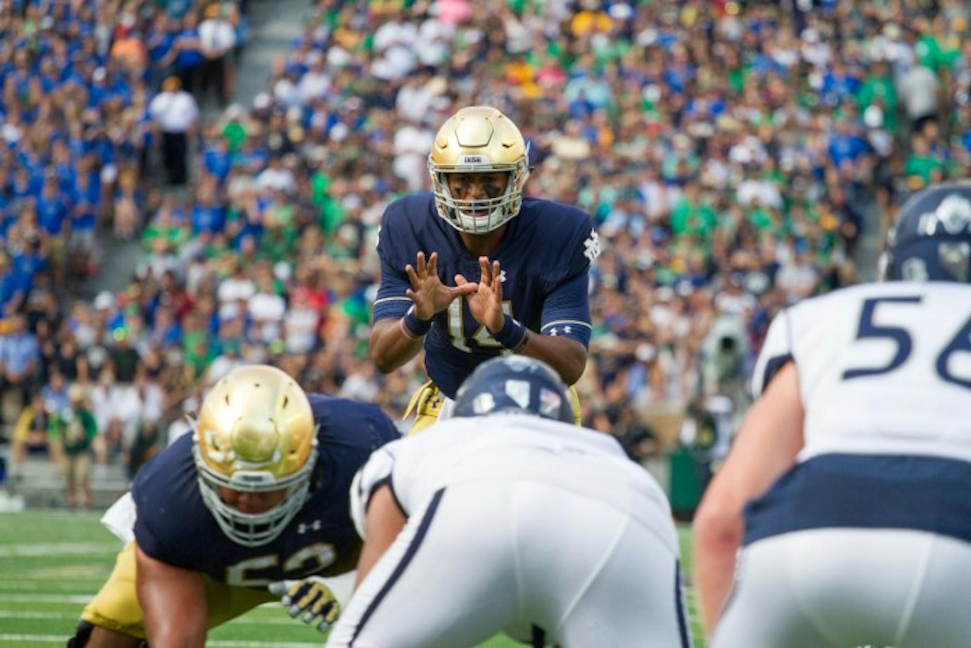 Irish junior quarterback DeShone Kizer prepares to take a snap during Notre Dame’s 39-10 win over Nevada on Saturday.