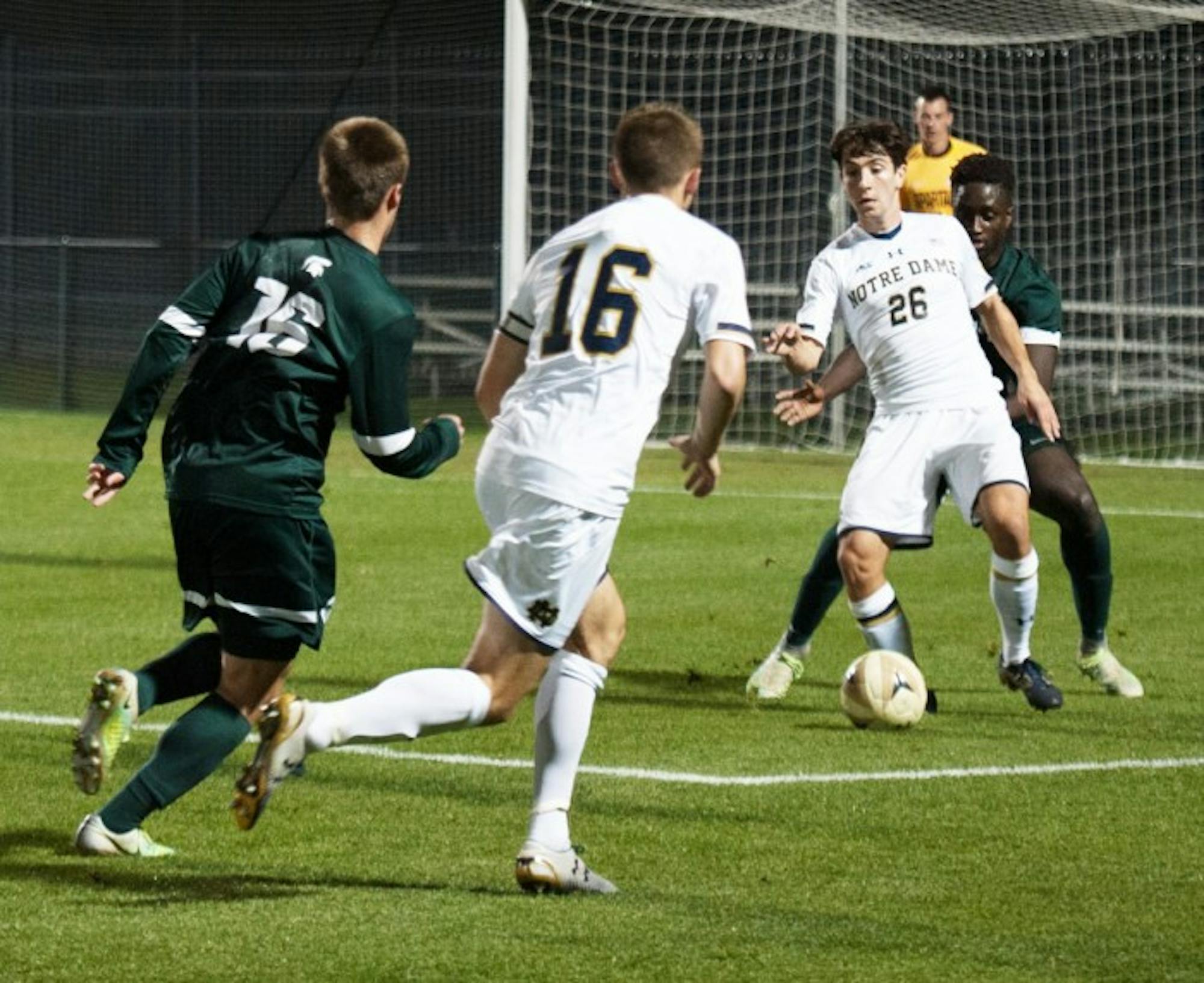 Irish senior midfielder Mark Gormley, right, looks to make a pass  during Notre Dame’s 1-0 loss to Michigan State on Tuesday.