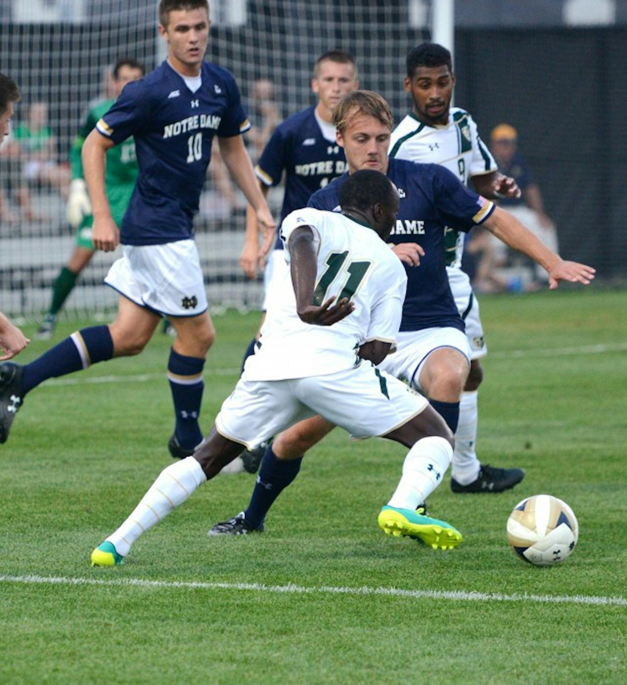 Irish graduate student defender Max Lachowecki, center, challenges for the ball during Notre Dame’s 2-0  victory over South Florida on Sept. 4 at Alumni Stadium. The Irish have not conceded any goals this season.