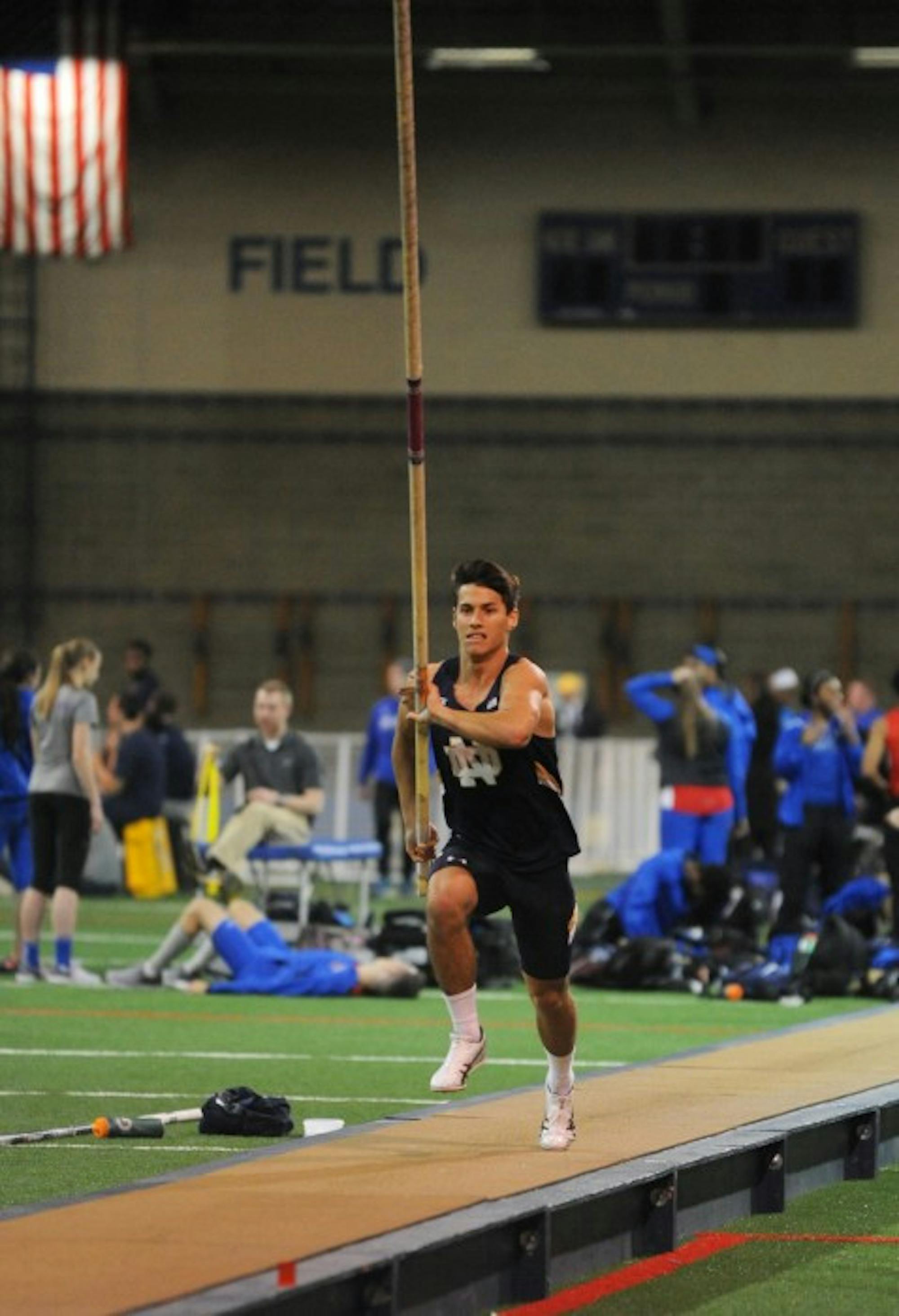 Irish freshman pole vaulter Landon Shank runs toward the bar during the Blue & Gold Invitational on Dec. 2. Shank finished third in the event finals after clearing a 4.70 meter jump.