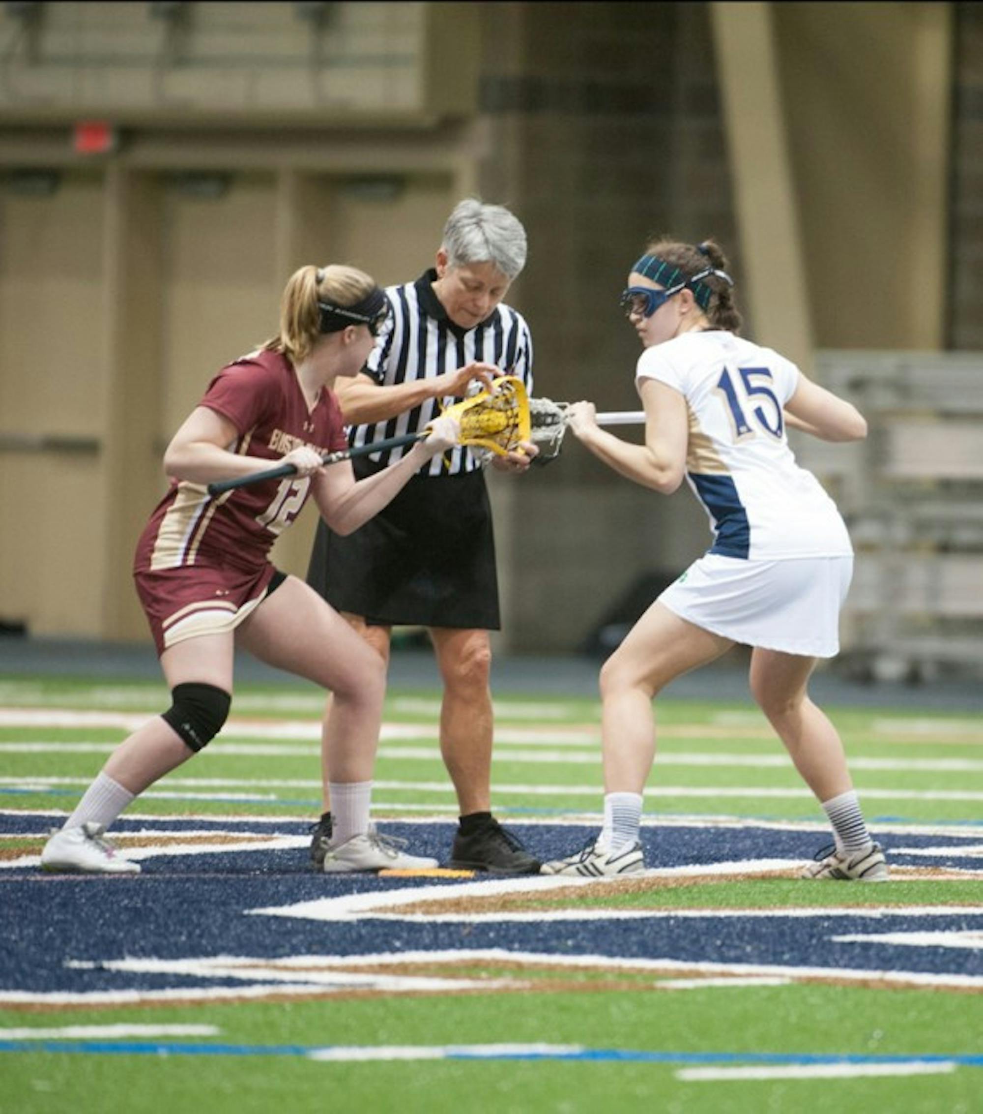 Freshman attack Cortney Fortunato (right) sets up for a draw in Notre Dame’s 15-10 loss to Boston College on Feb. 15.