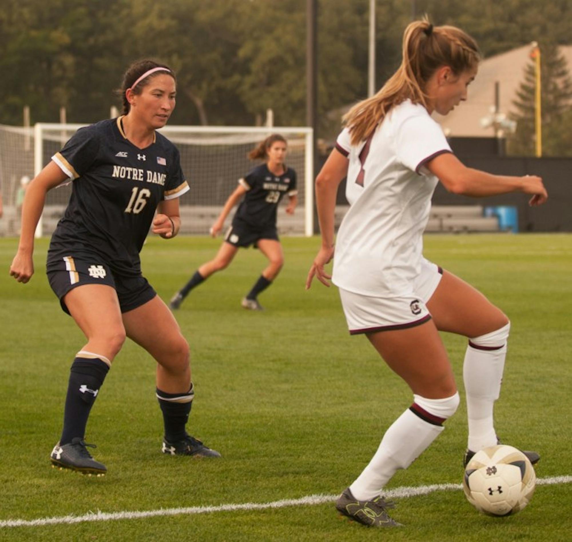 Irish graduate student midfielder Sandra Yu defends an opponent during Notre Dame's 1-0 double-overtime loss to South Carolina on Sept. 1 at Alumni Stadium.