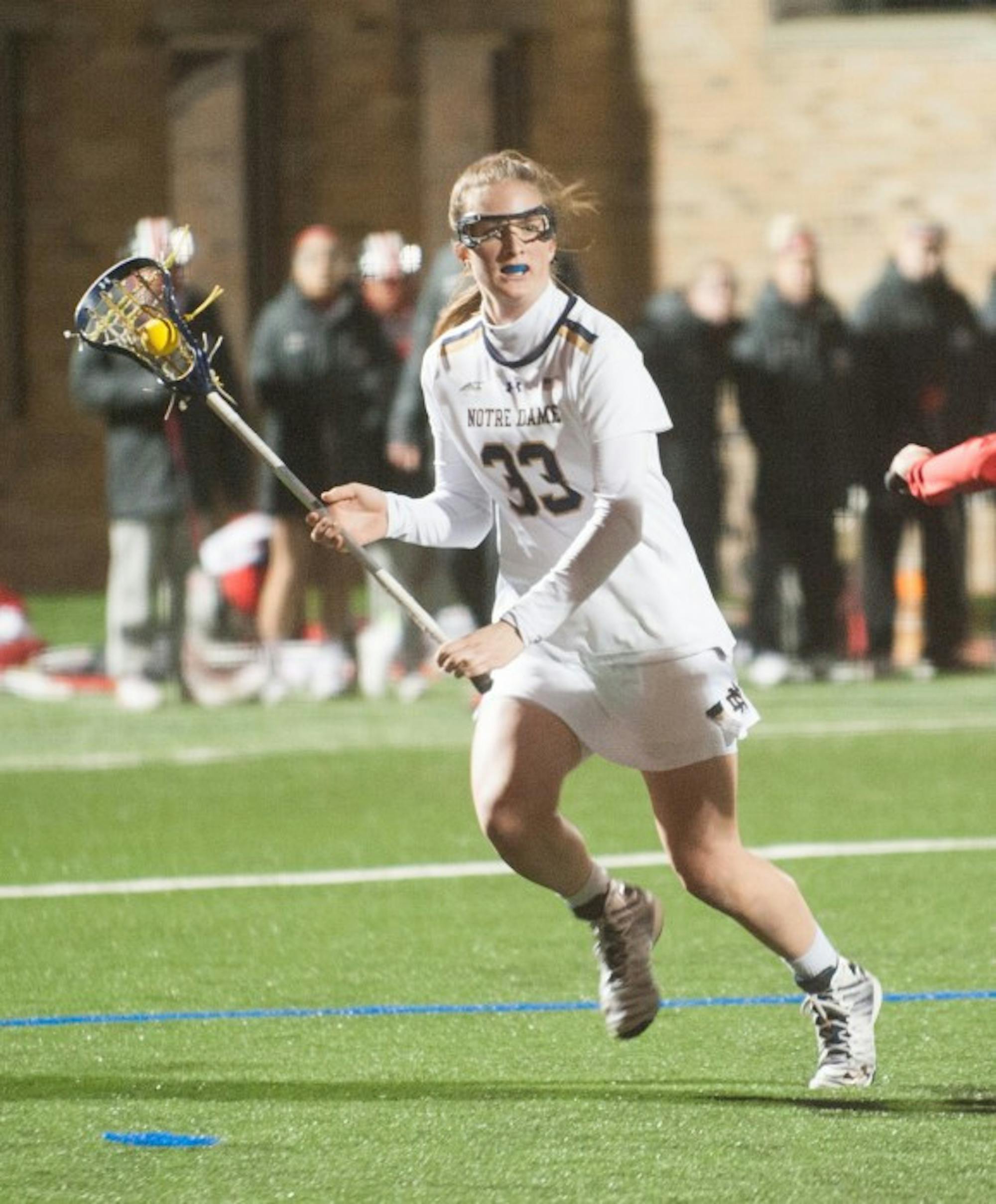 Irish sophomore midfielder Samantha Lynch looks for a teammate during Notre Dame's 16-13 win over Ohio State on March 7 at Arlotta Stadium.