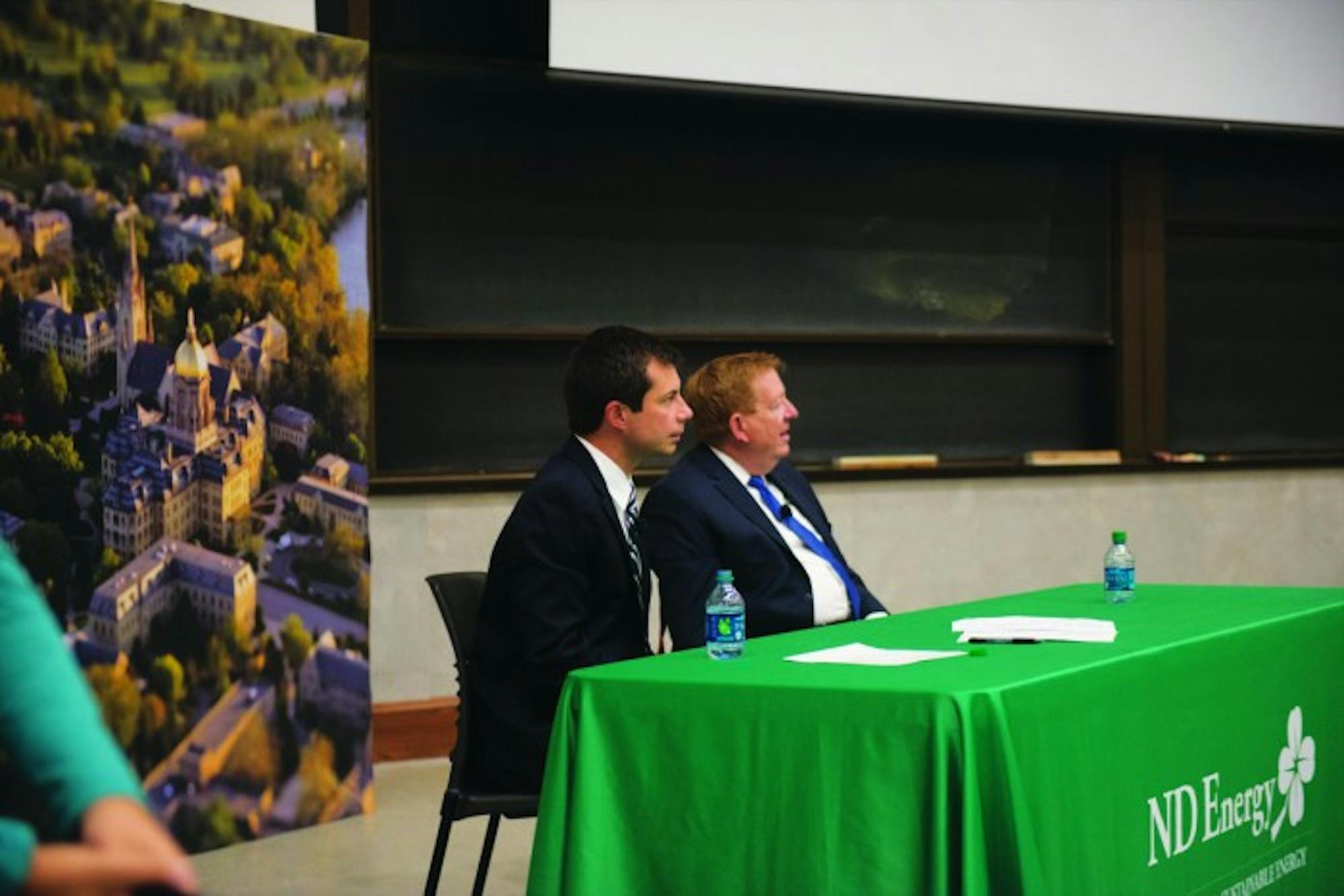 Mayors Pete Buttigieg and James Brainard of South Bend and Carmel, respectively, speak on the environmental impact of cities Thursday.