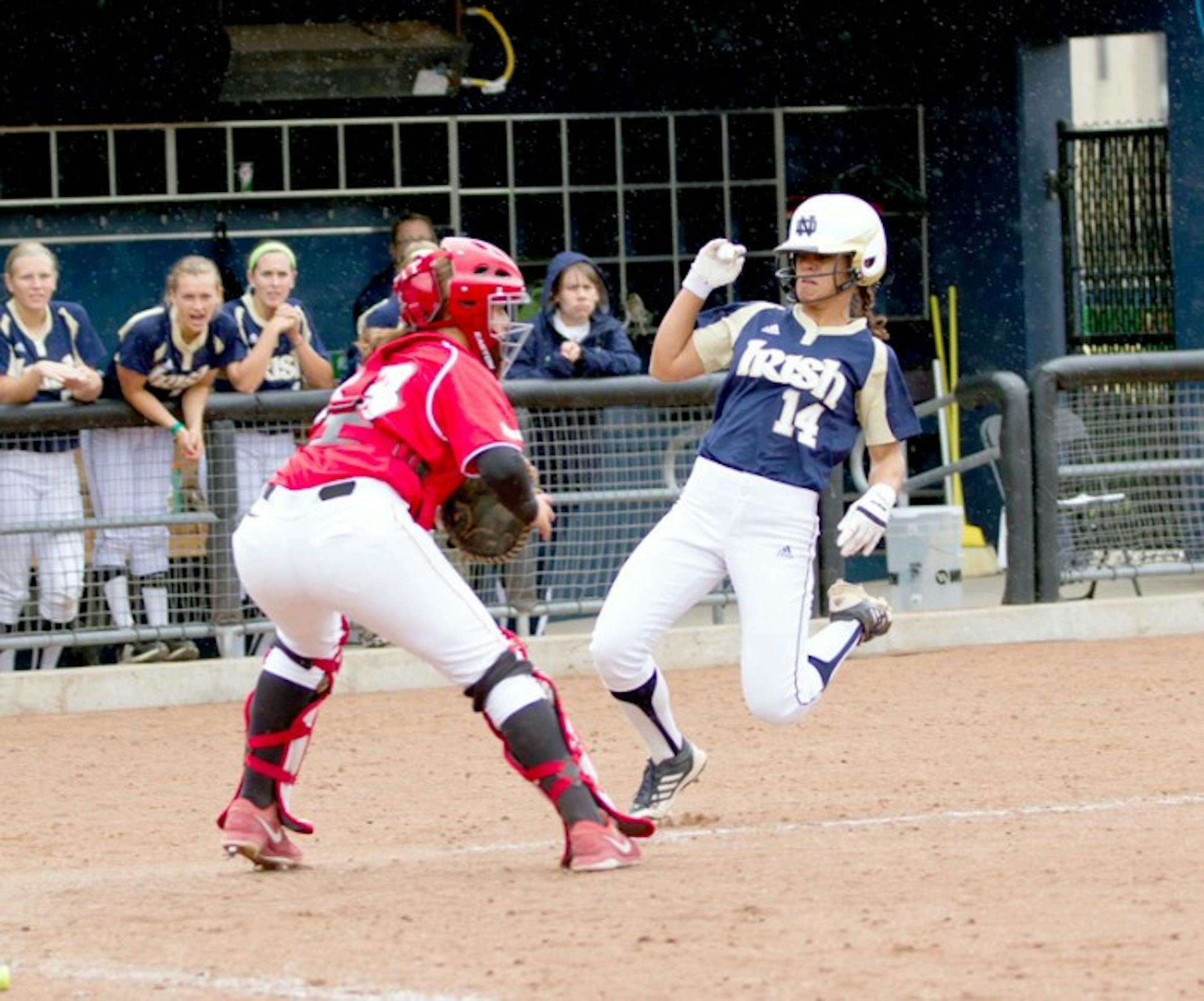 Irish senior outfielder Monica Torres prepares to collide with the catcher at home plate durng an exhibition against Illinois State on Sept. 5, 2013.