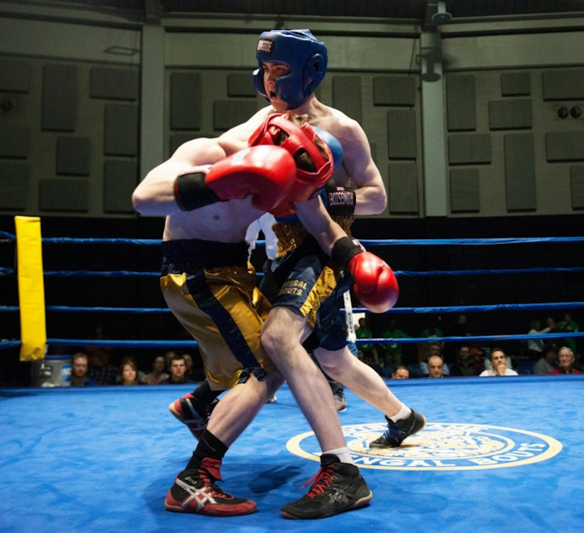 Sophmore Patrick “Il Lupo”  Brennan, left, is declared the winner in his semifinal bout against junior EJ “Binks” Leppert on Wednesday night.