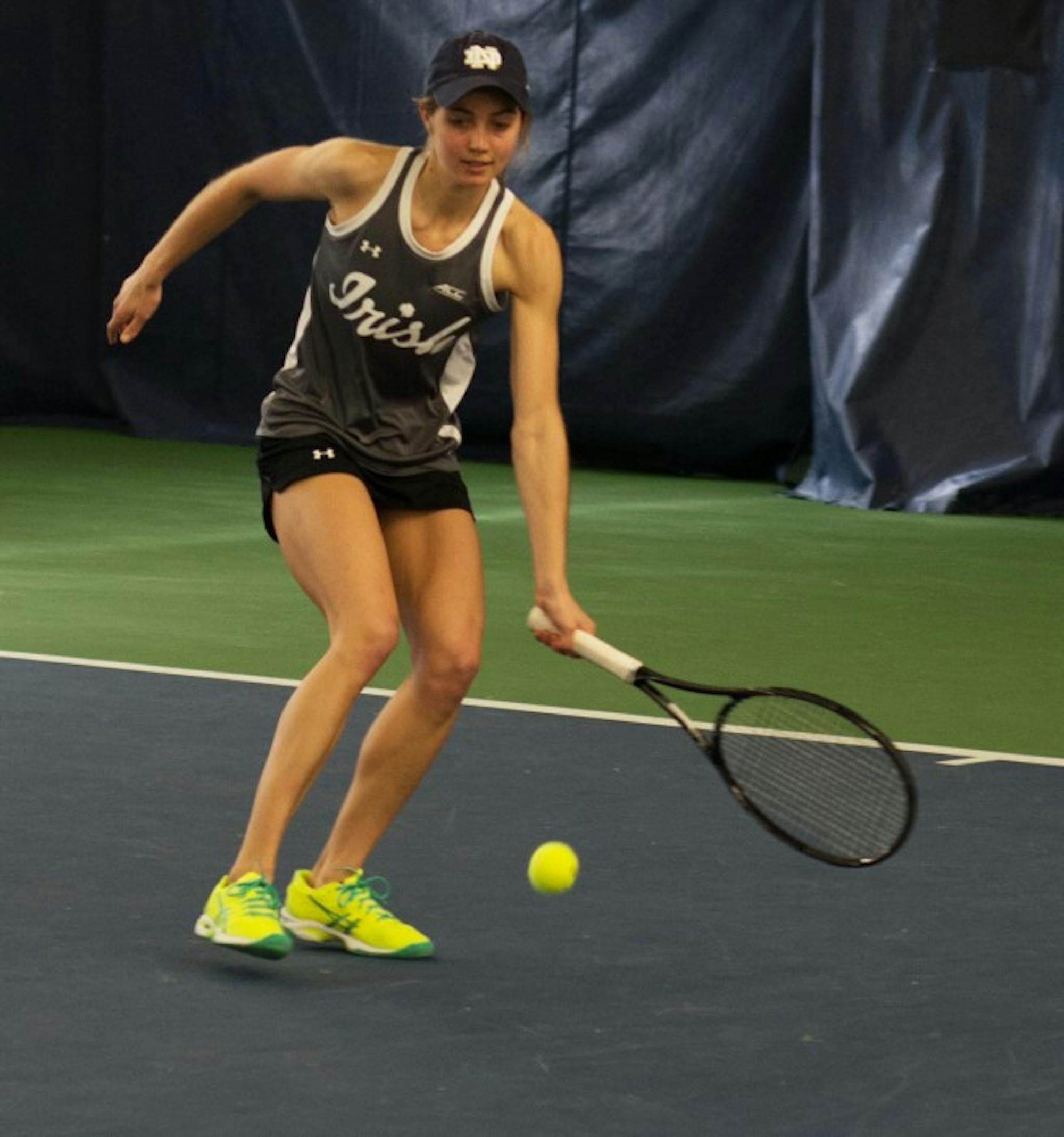 Irish junior Mary Closs reaches to return a shot during Notre Dame’s 6-1 win over Indiana. Closs won her singles match, 6-3, 6-1.