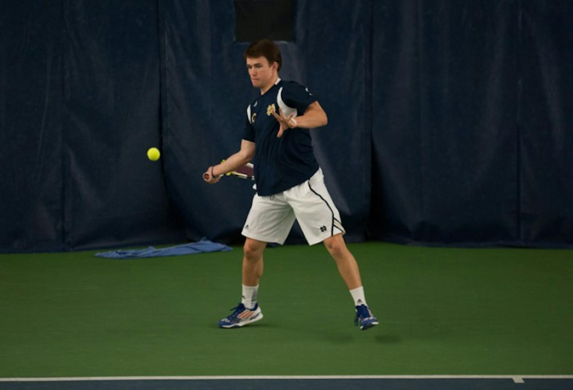 Senior Greg Andrews prepares to hit a forehand in a match against Kenturcky on Sunday. Andrews lost his singles match, but won his doubles match with sophomore Alex Lawson as the Irish defeated the Wildcats 4-3.