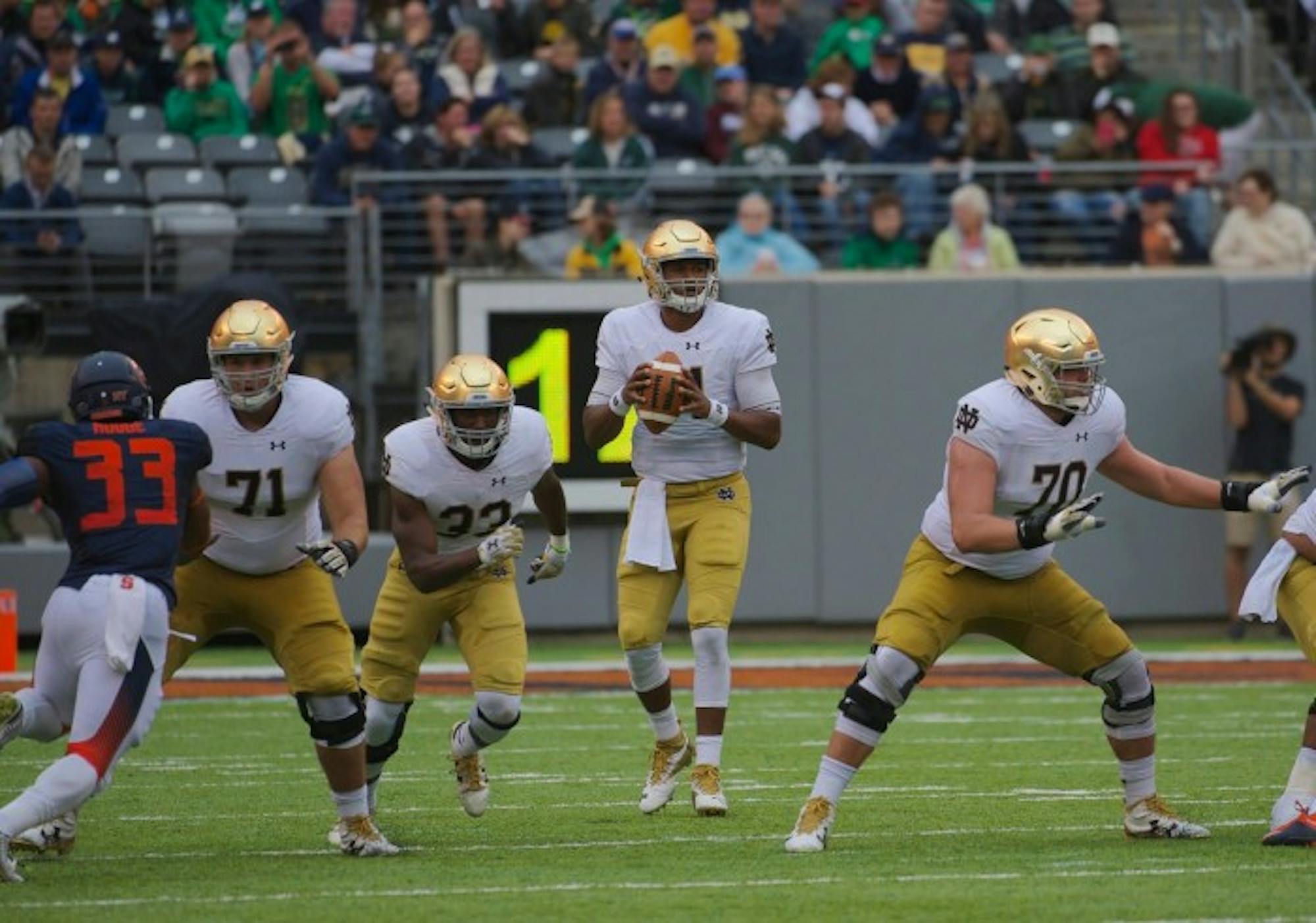 Irish junior quarterback DeShone Kizer drops back in the pocket in Notre Dame's 50-33 victory over Syracuse at MetLife Stadium.