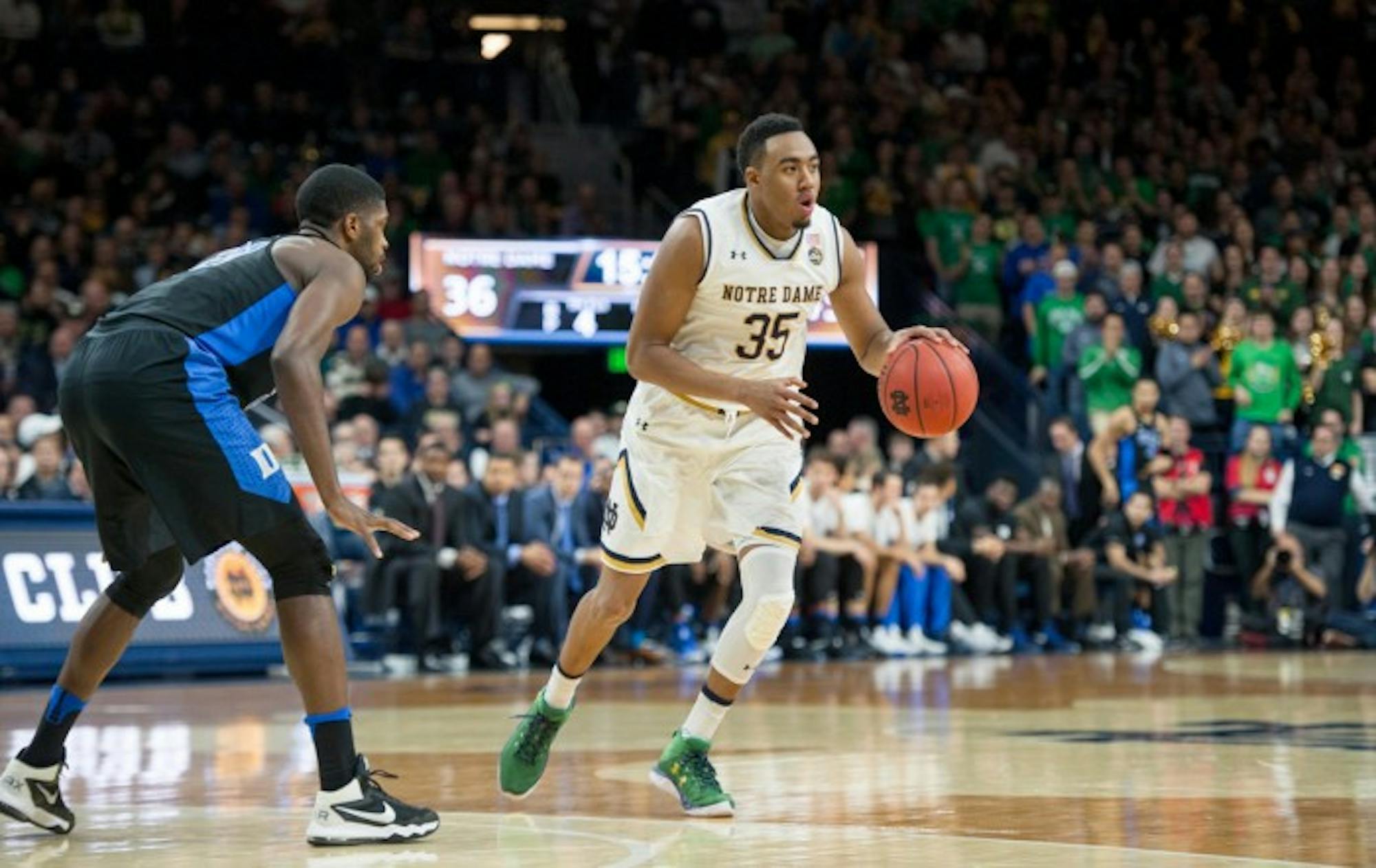 Irish junior forward Bonzie Colson dribbles around the 3-point line during Notre Dame’s 84-74 loss to the Blue Devils on Monday at Purcell Pavilion. Colson picked up 17 points and nine rebounds in the game.