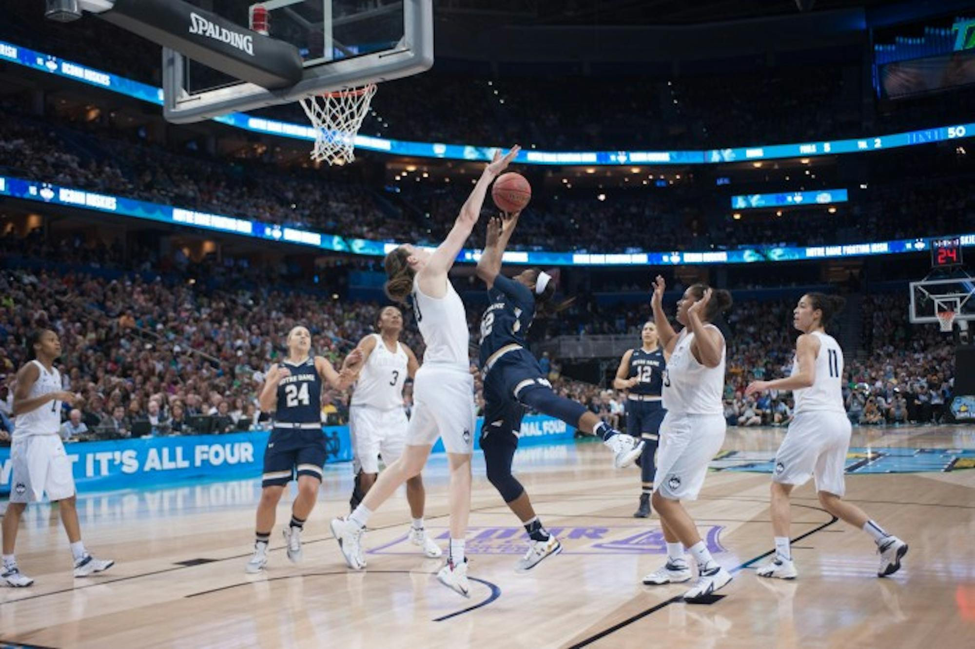 Irish junior guard Jewell Loyd elevates for a shot against Connecticut's Breanna Stewart during Tuesday's 63-53 loss.
