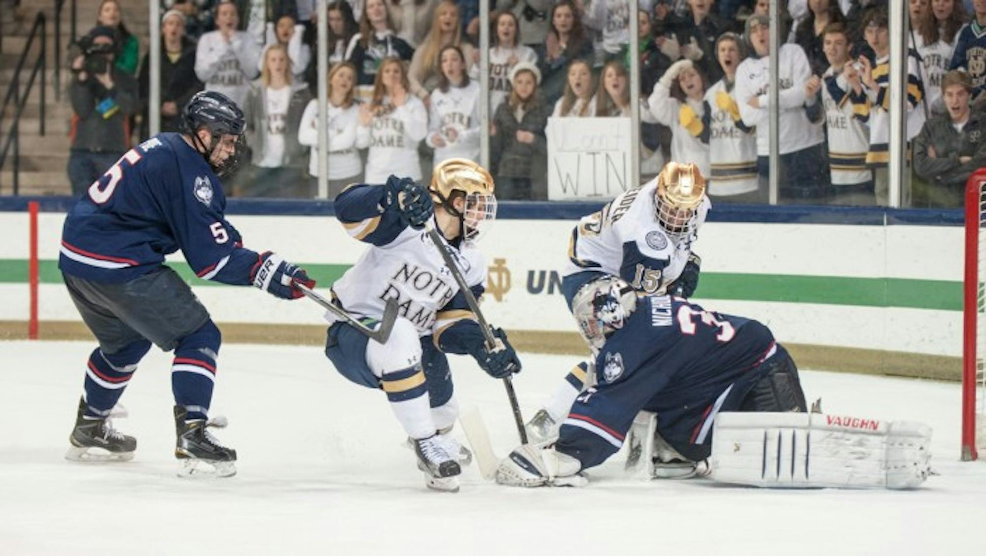 Freshman Anders Bjork tries to knock in a rebound during Notre Dame's 3-3 tie against Connecticut on Jan. 16.