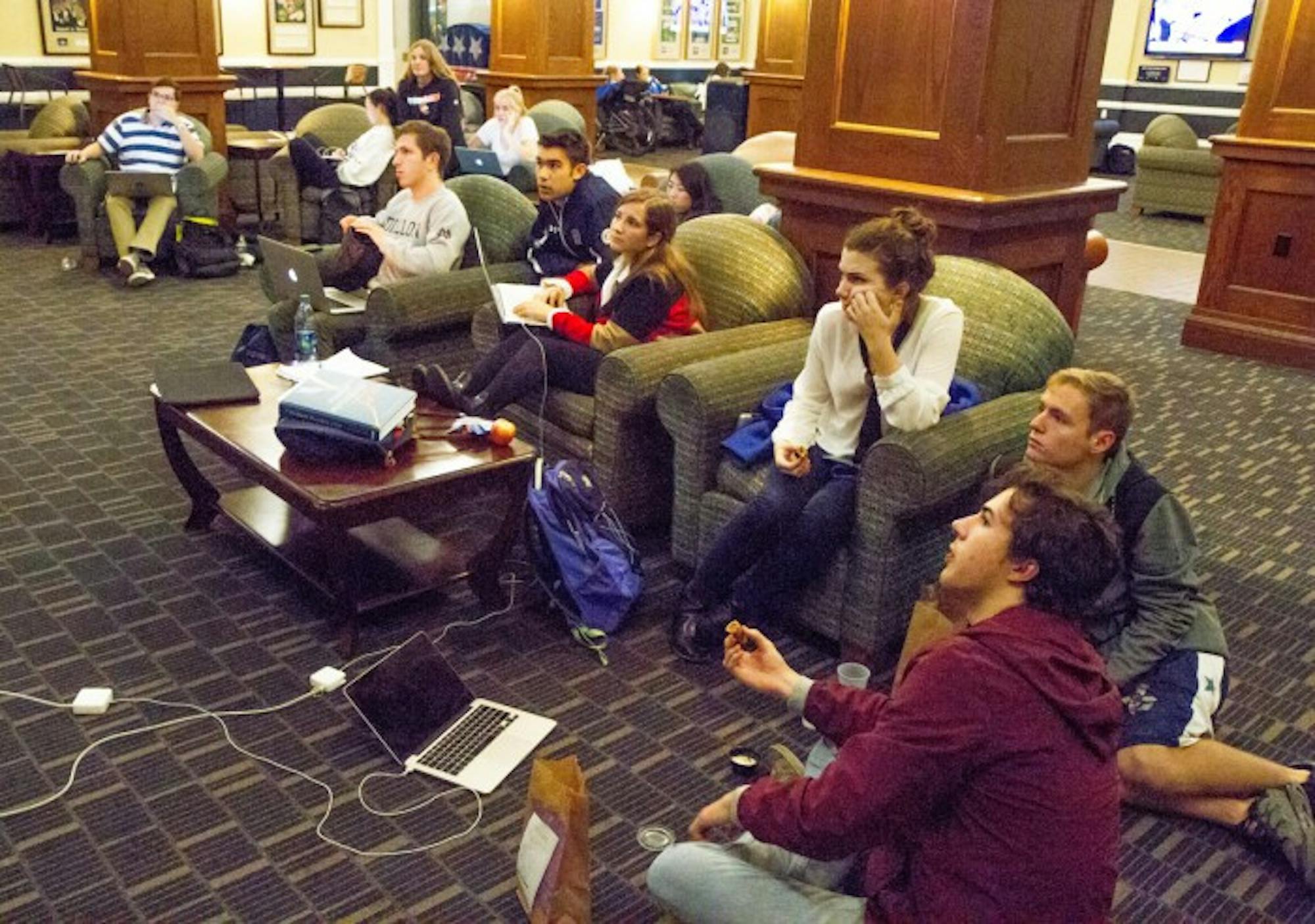 Students anxiously watch the election results on the TV in the lobby of LaFortune Student Center on Tuesday.