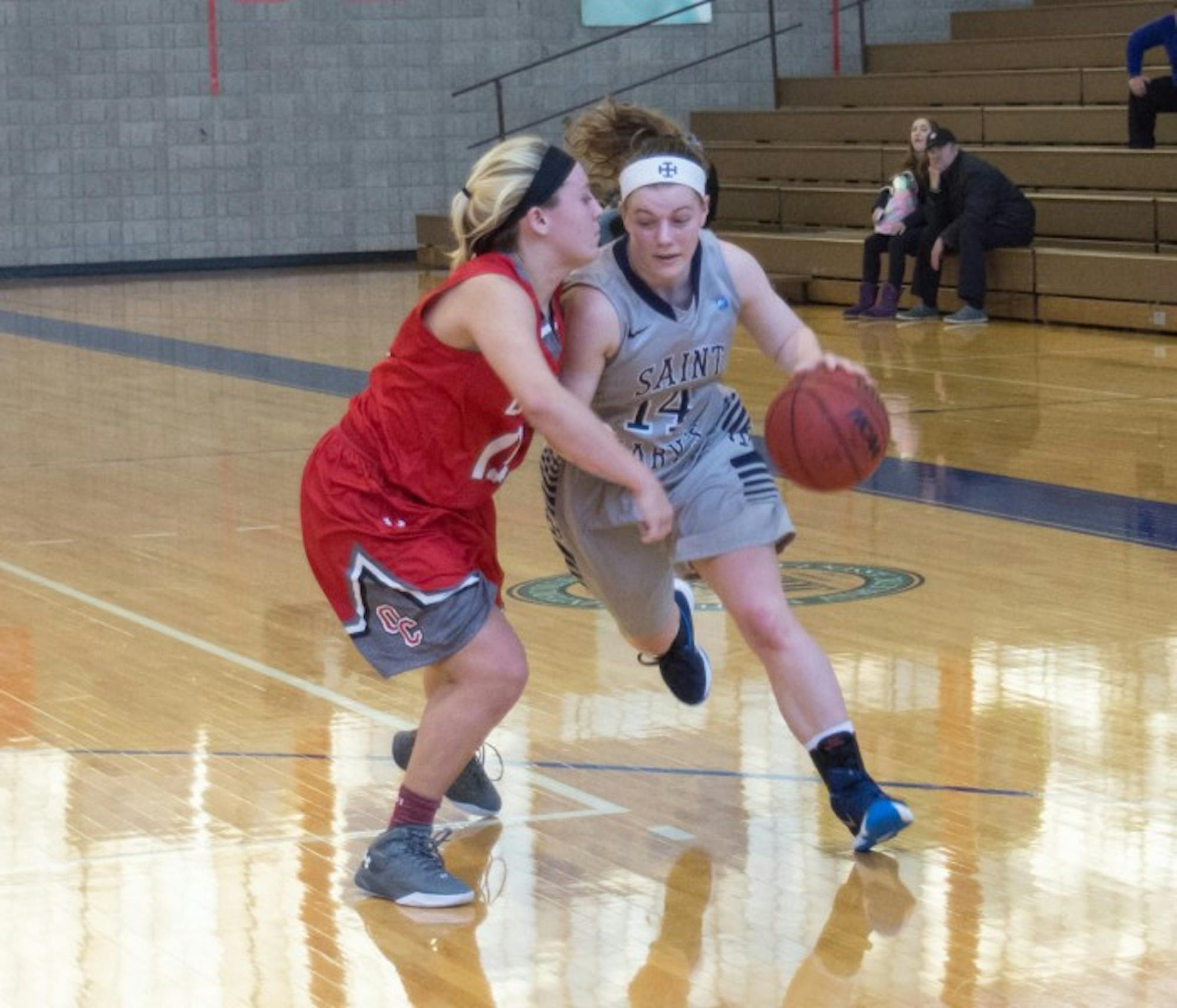 Saint Mary’s freshman guard Erin Maloney attempts to drive past a defender during a 52-49 loss to Olivet on Jan. 23 at Angela Gym. Maloney had six points and four rebounds in the game.