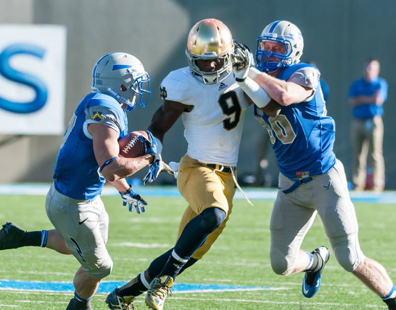 2013-Football-20131026-Air-Force-Jaylon-Smith-Michael-Kramm-Win