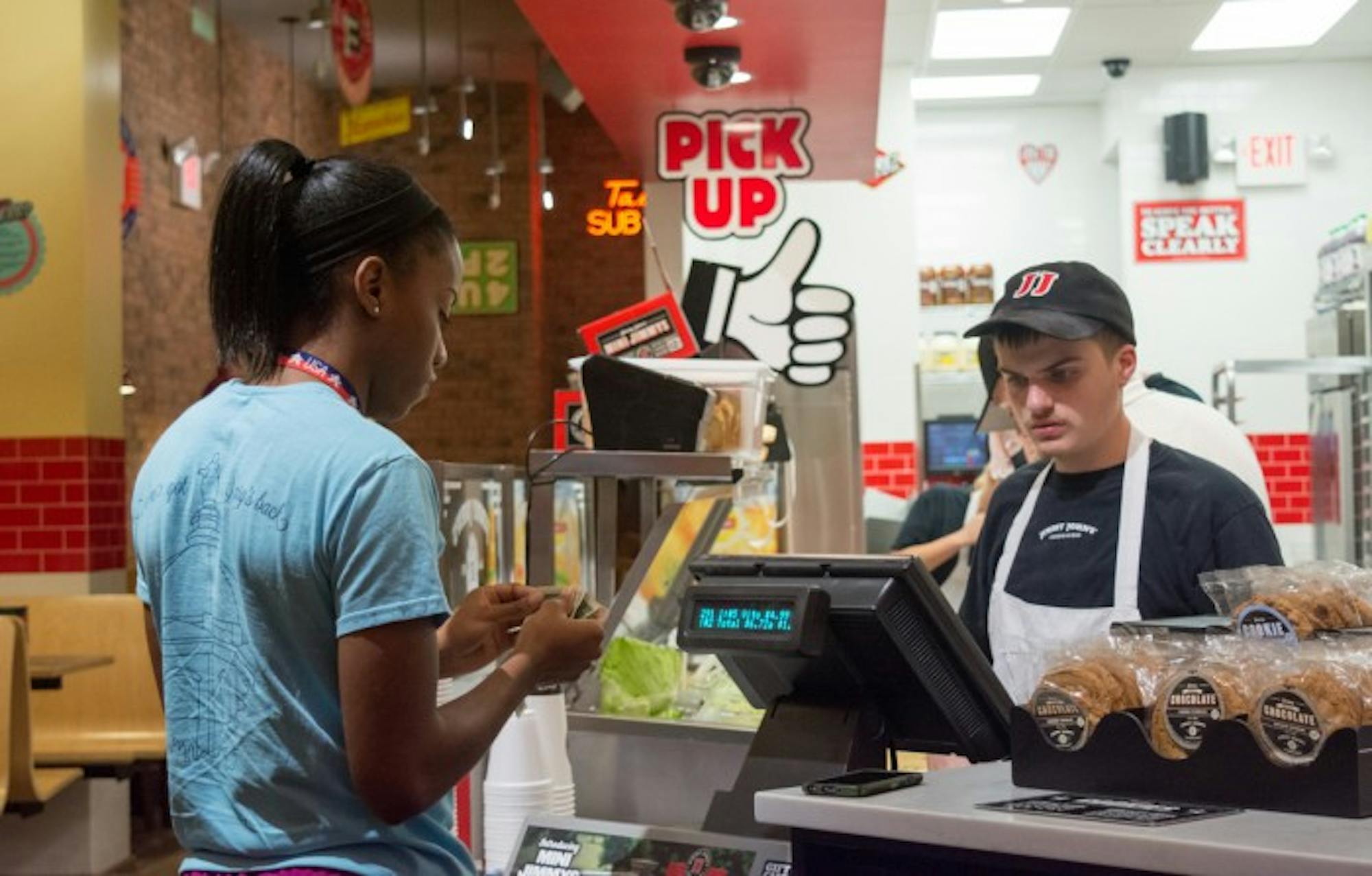 Notre Dame senior Lindsay Allen orders dinner at the new Jimmy John’s location on Eddy Street on Sunday. The restaurant joins other chains such as Chipotle and Five Guys.