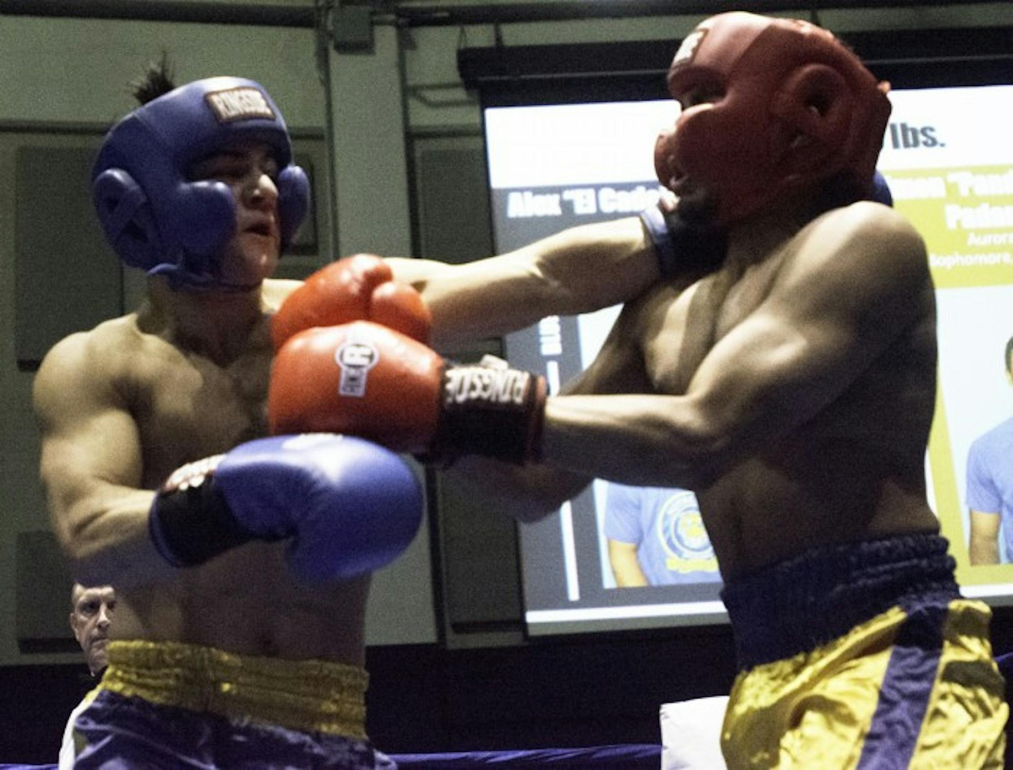 Alumni senior and Bengal Bouts captain Alex Alcantara lands a left jab to his opponent, Keough sophomore Simon Padanilam, during a preliminary round bout Feb. 14 at the Joyce Center Fieldhouse.