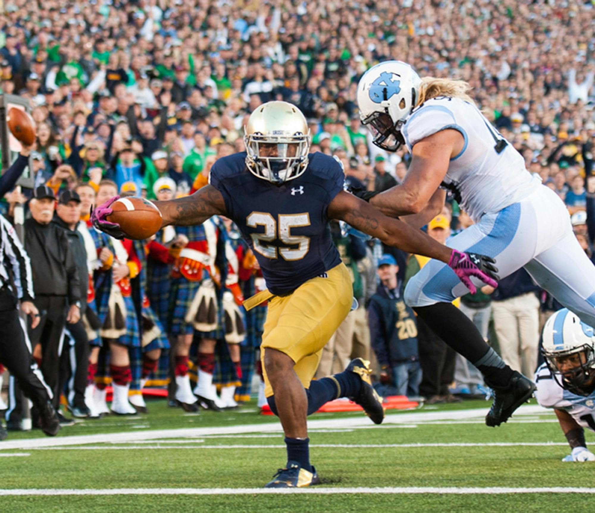 Irish sophomore running back Tarean Folston extends for one of his three touchdowns during Notre Dame’s 50-43 victory over North Carolina on Saturday at Notre Dame Stadium.
