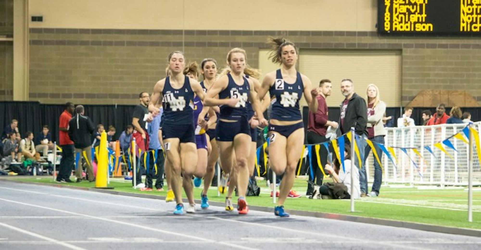 Irish sophomore Jessica Harris, 2, leads the pack during the 800-meter run at the Alex Wilson Invitational at Loftus Sports Center on Feb. 20. Harris broke the school record in the 800-meter run Friday.