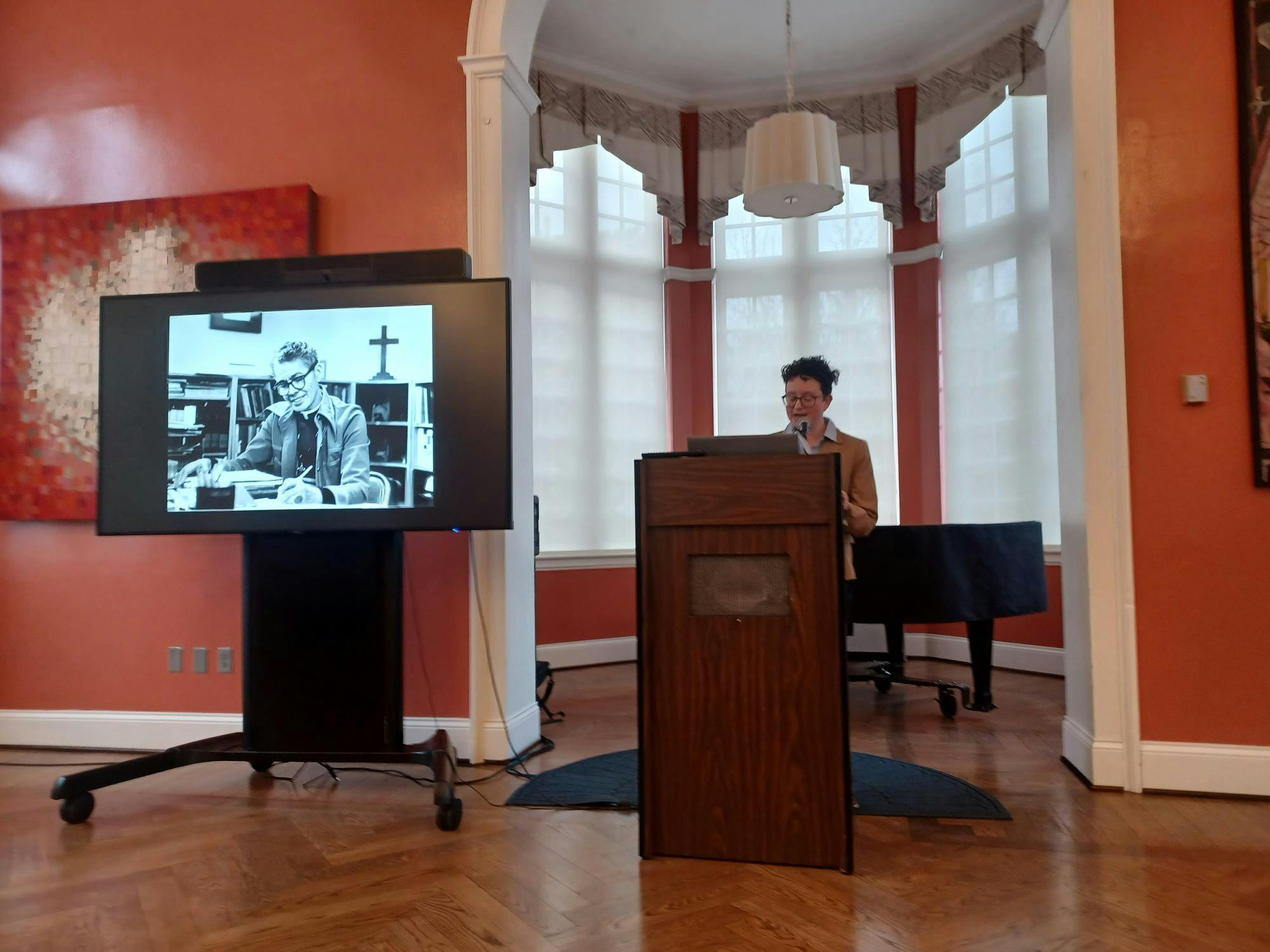 Assistant Director of the LGBTQ+ Center Eli Williams presents Dr. Pauli Murray.