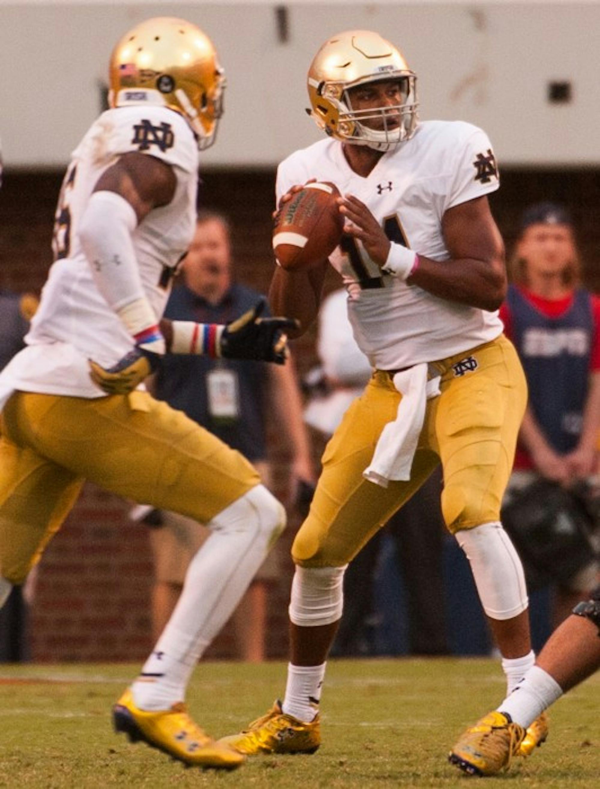 Sophomore quarterback DeShone Kizer drops back for a pass in Notre Dame’s dramatic come from behind victory over Virginia on Saturday. He will take over as the starter this weekend against Georgia Tech.