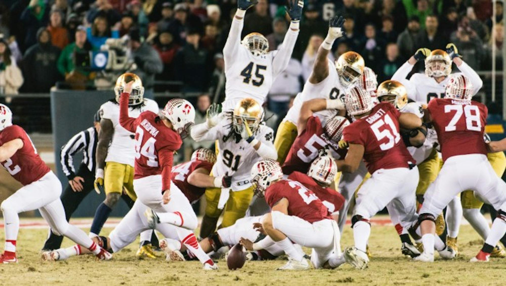 Cardinal senior kicker Conrad Ukropina kicks the game-winning 45-yard field goal to lift Stanford over Notre Dame, 38-36, at Stanford Stadium on Saturday. Irish sophomore quarterback DeShone Kizer led an 88-yard touchdown drive to put the Irish ahead with 30 seconds left before Ukropina’s right leg kicked Notre Dame out of playoff contention.