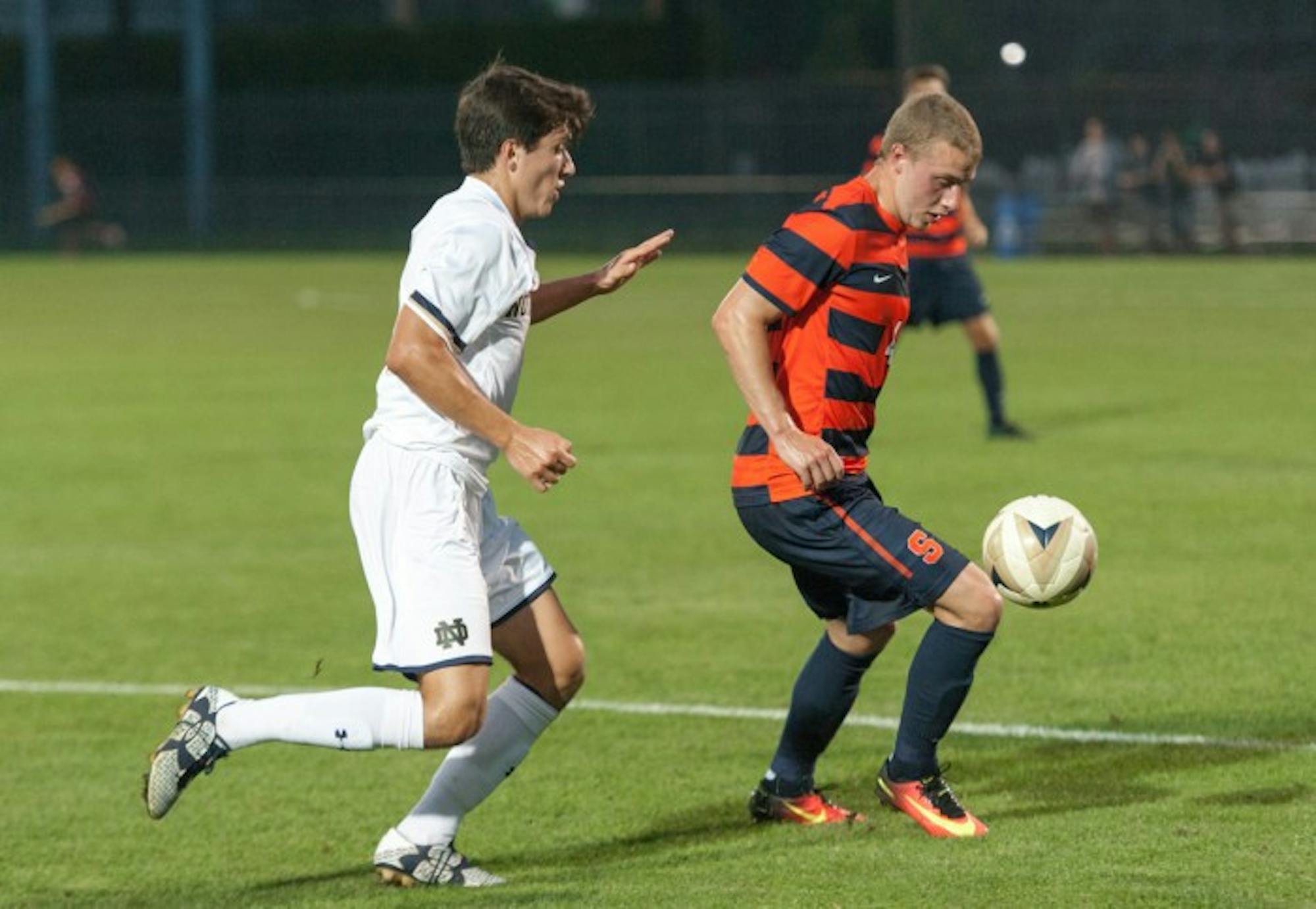 Irish freshman midfielder Jack Casey looks to attack the loose ball during Notre Dame’s 2-1 win over Syracuse on Friday at Alumni Stadium. Casey scored the first goal of the game for the Irish.