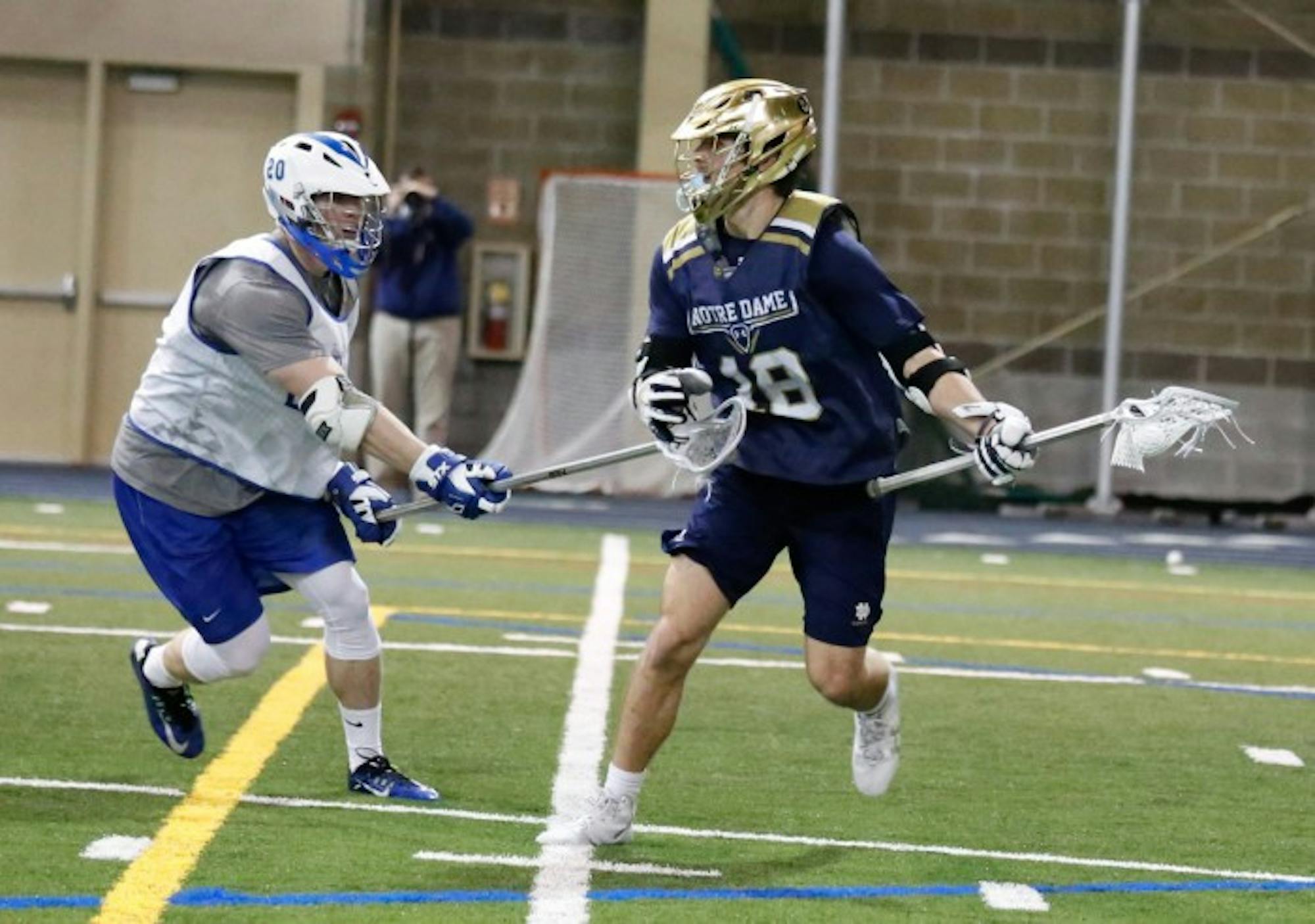 Irish senior attack Eddy Lubowicki looks for a teammate during an exhibition match against Air Force on Jan. 30 at Loftus Sports Center.
