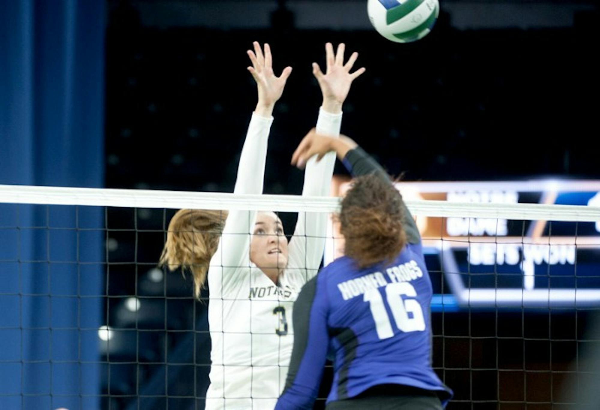 Irish freshman middle blocker Sam Fry leaps up for a block in Notre Dame’s 3-1 loss to TCU on Sept. 19 at Purcell Pavilion.