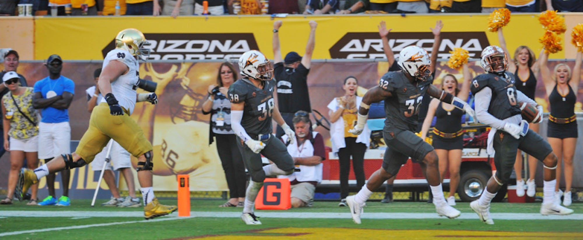 Arizona State redshirt junior defensive back Lloyd Carrington scampers into the end zone with a 58-yard interception return for a touchdown in the fourth quarter of the Sun Devils’ 55-31 win.
