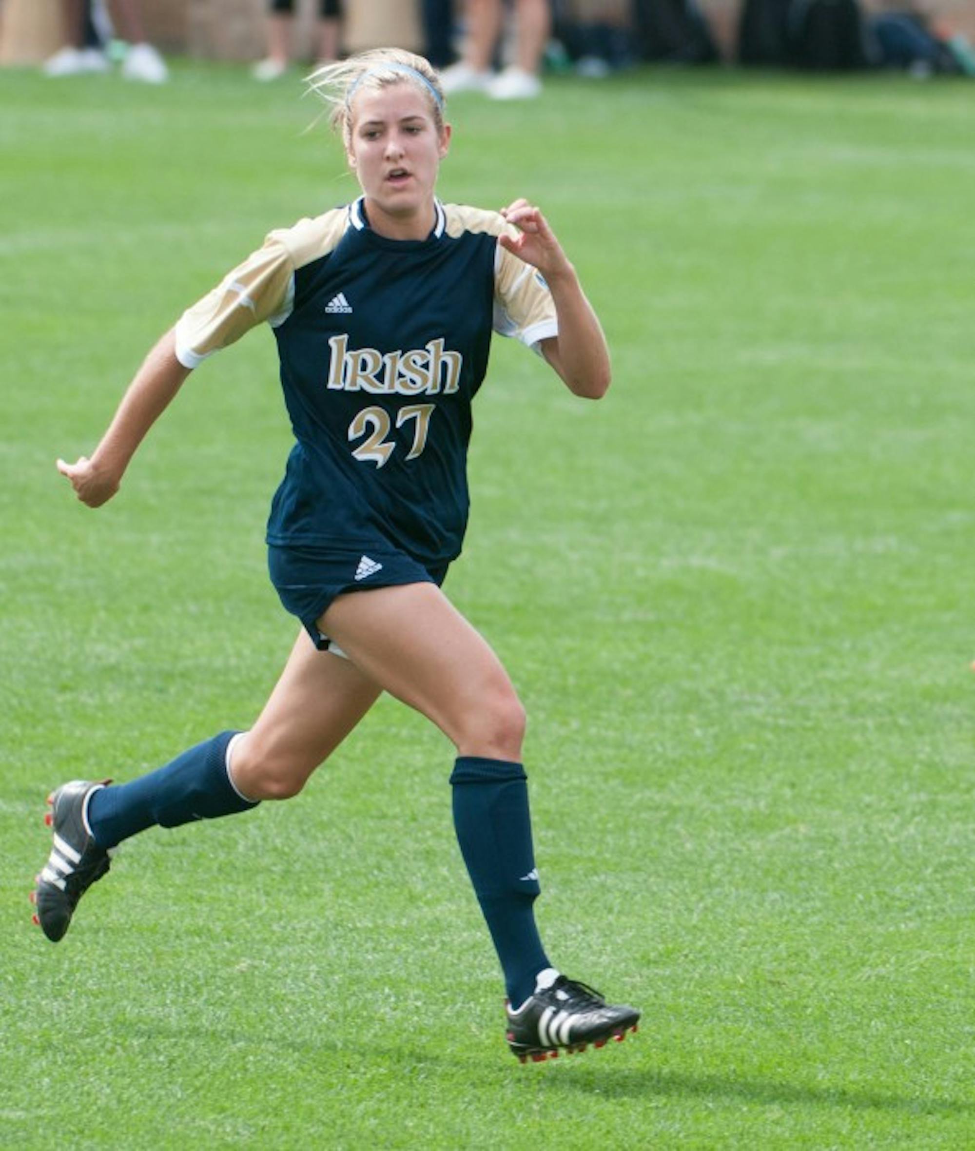 Irish sophomore forward Kaleigh Olmsted sprints up the pitch against UCLA on Sept. 1, 2013 at Alumni Stadium. Olmsted registered her first point this season Sunday with an assist against Toledo.