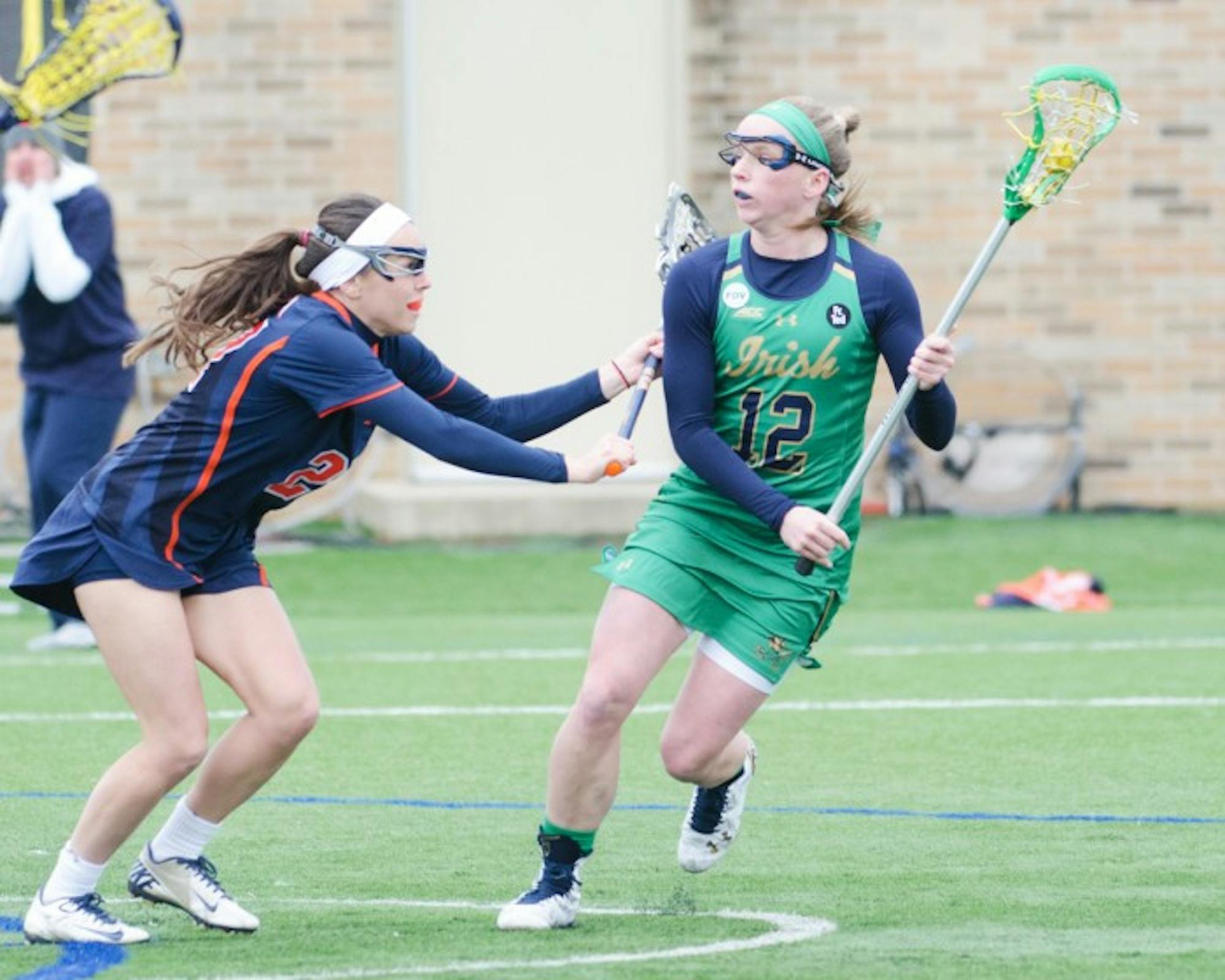 Irish junior midfielder Alex Dalton looks to pass in Notre Dame’s 16-4 win over Virginia on March 19 at Arlotta Stadium.  Dalton scored two goals in the first ten minutes of the game against Syracuse.