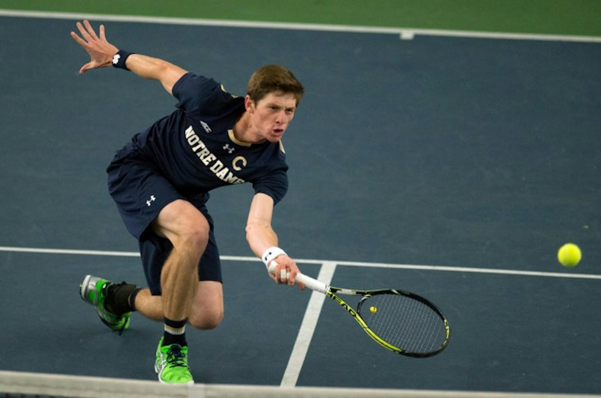 Junior Quentin Monaghan lunges for a shot during a 4-3 win against Oklahoma State at Eck Tennis Pavilion on Jan. 24.