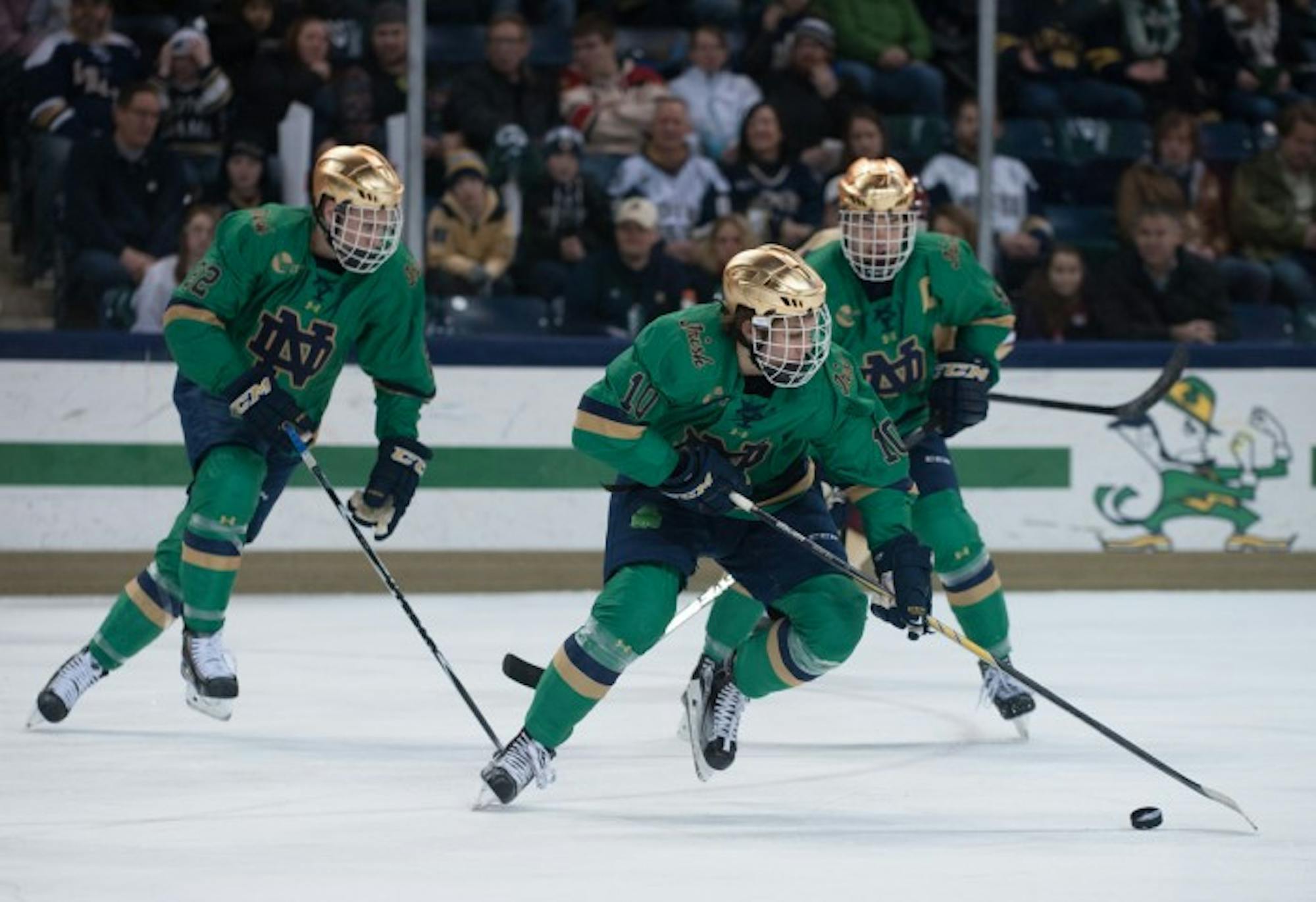 Sophomore left wing Anders Bjork carries the puck down the ice during Notre Dame’s 3-1 victory over Boston College on Feb. 28 at Compton Family Ice Arena.